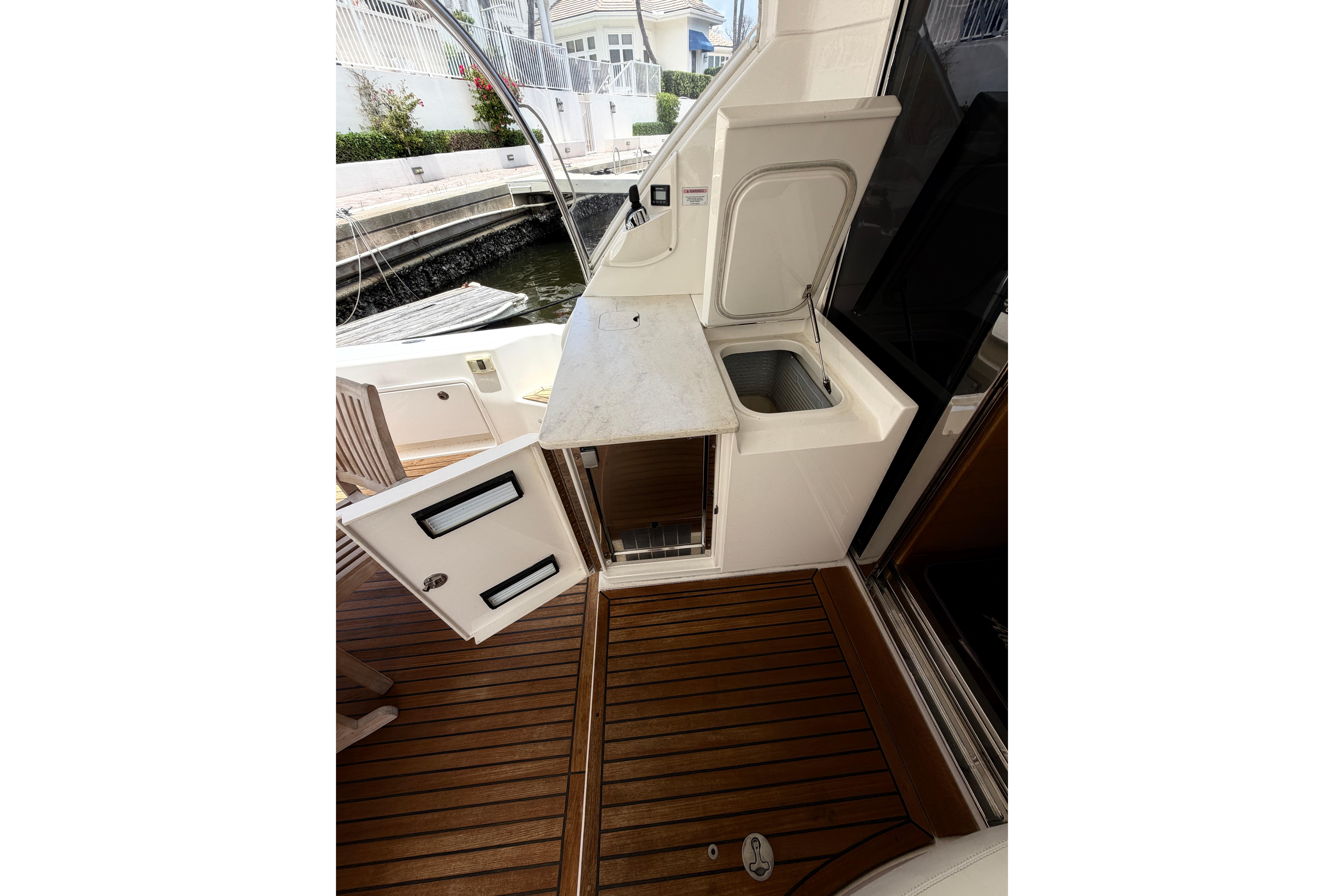 Port amenity with icemaker, refrigerated cooler box and built in trash receptacle