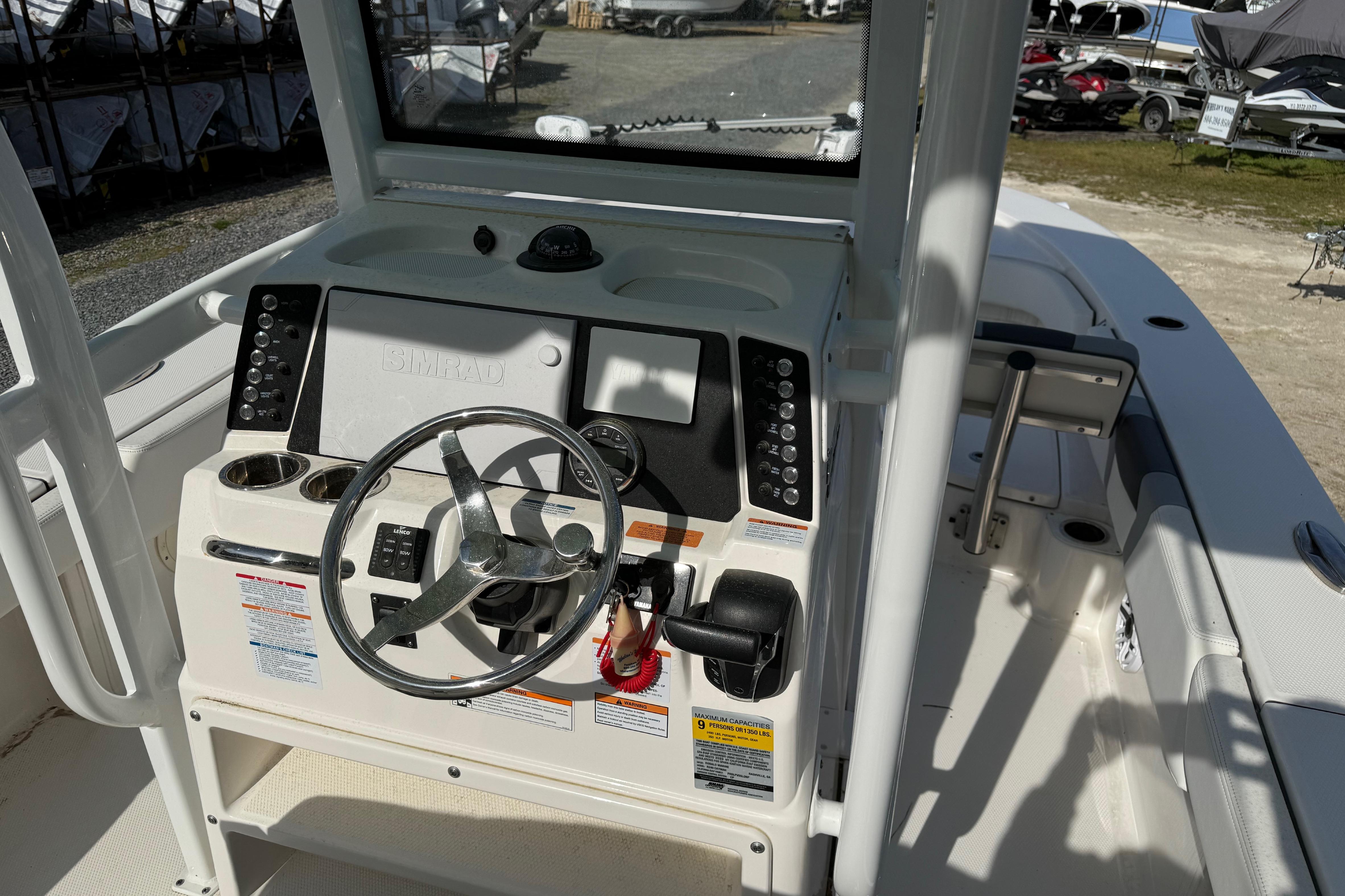 2023 Robalo 246 Cayman boat dashboard with steering wheel and controls.