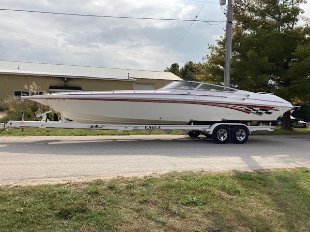 2001 Fountain Lightning boat parked on trailer.