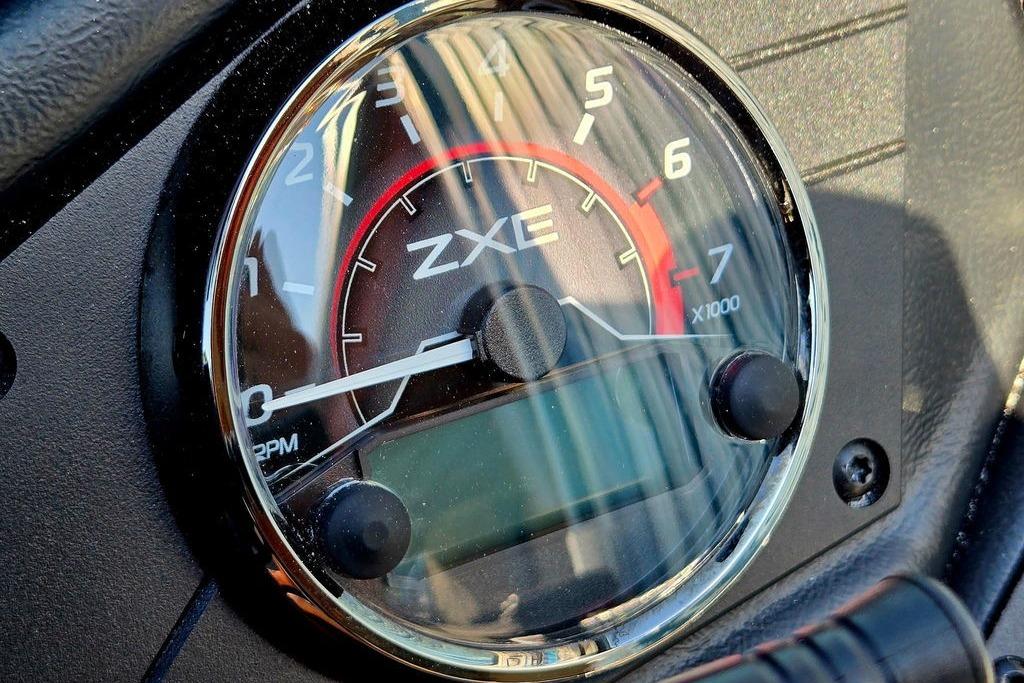 Close-up of 2026 Skeeter ZXE20 tachometer, displaying RPM gauge with chrome trim.