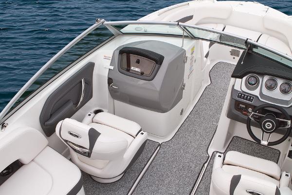 Manufacturer Provided Image: 2016 Chaparral 244 Sunesta boat interior with seating and dashboard, on water.