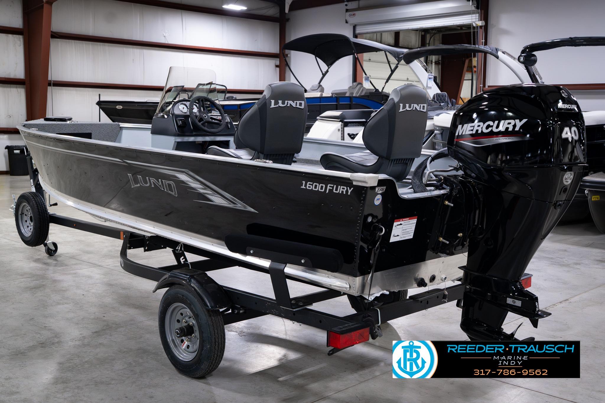 2026 Lund 1600 Fury SS boat with Mercury 40 engine in showroom.