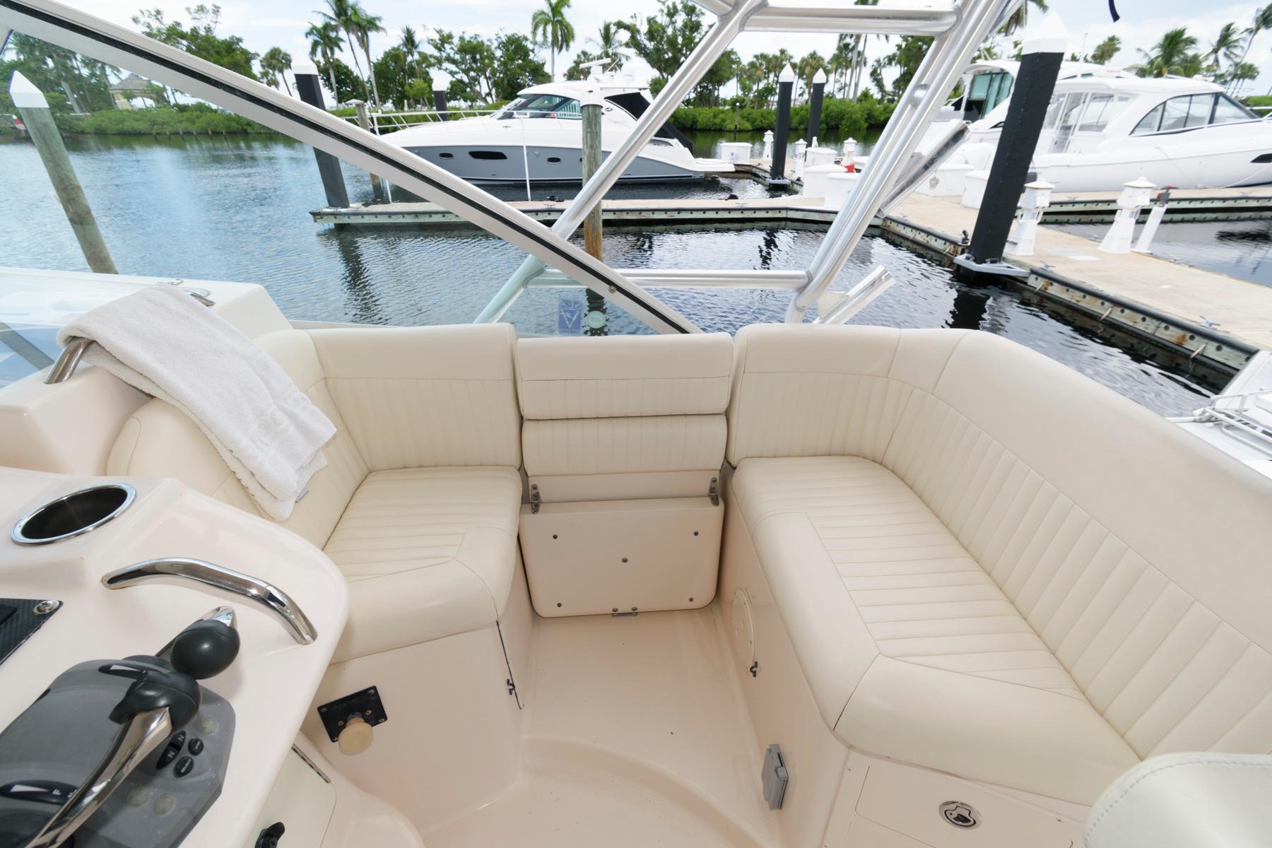 2007 Grady-White Express 360 boat interior with white seating, docked at marina.