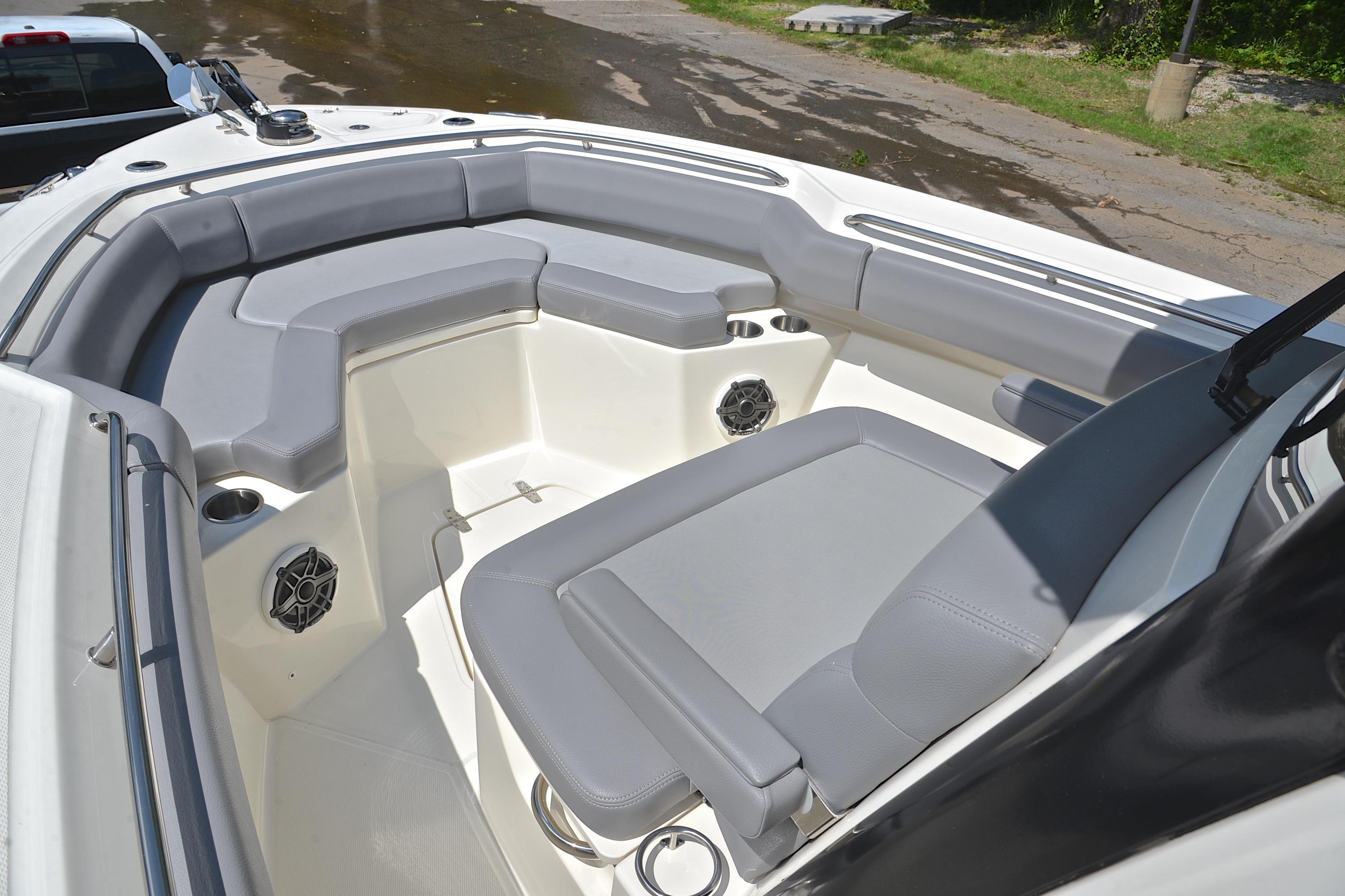 2024 Boston Whaler 250 Outrage boat interior with gray seating and cup holders.