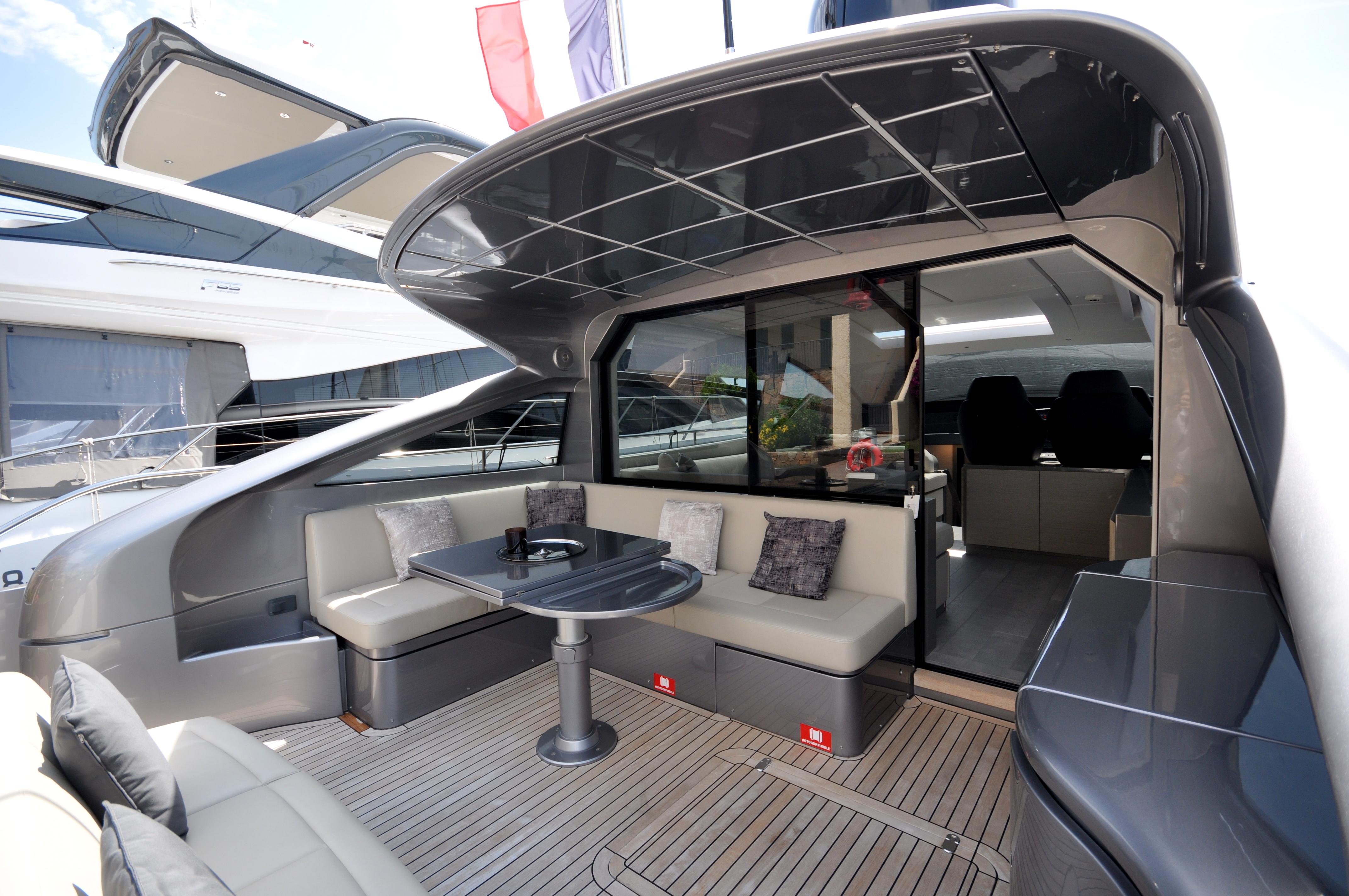 Luxurious 2020 Pershing 62' yacht with sleek outdoor seating and modern design.