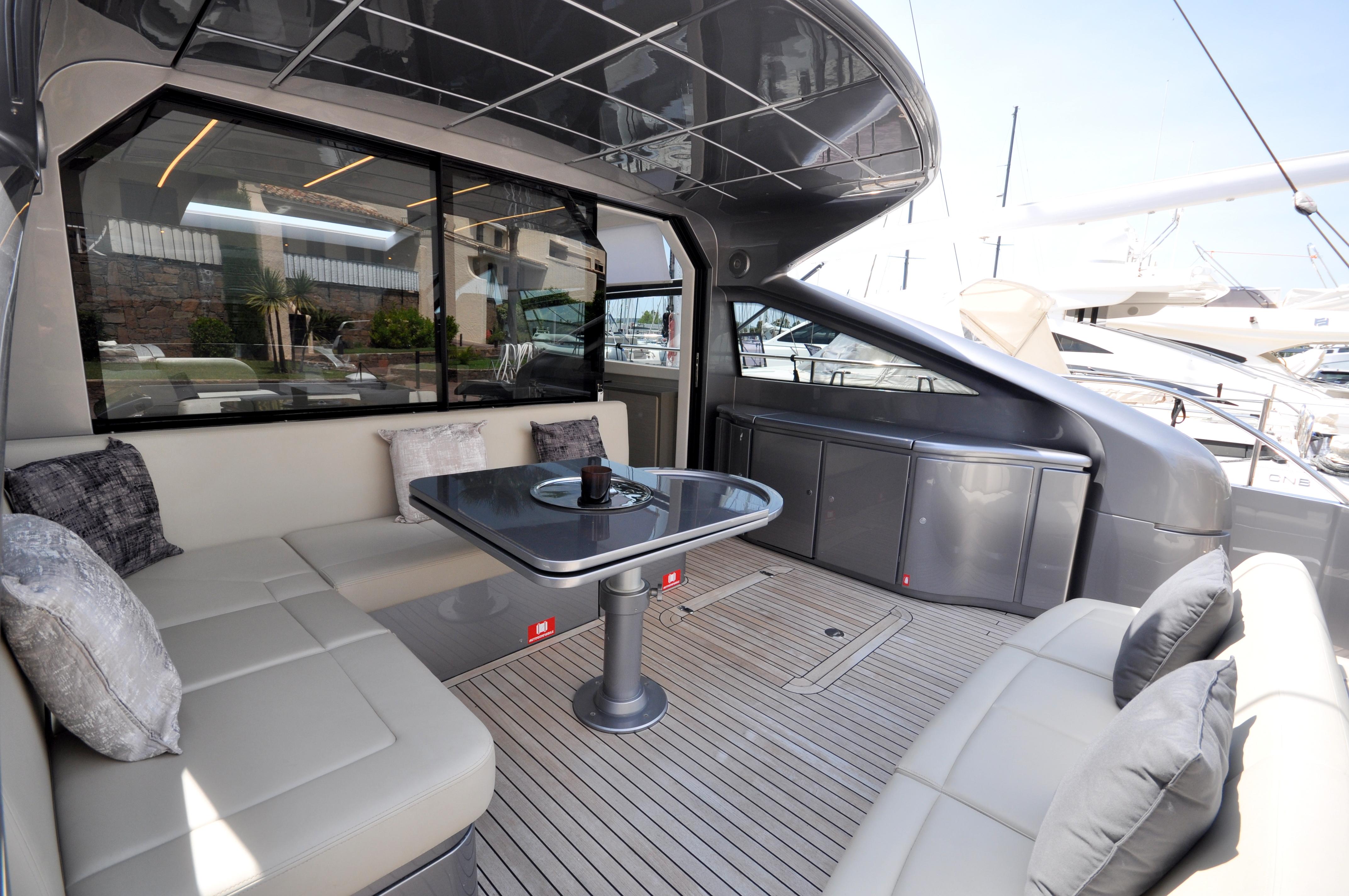Luxurious 2020 Pershing 62' yacht interior with elegant seating and modern design.