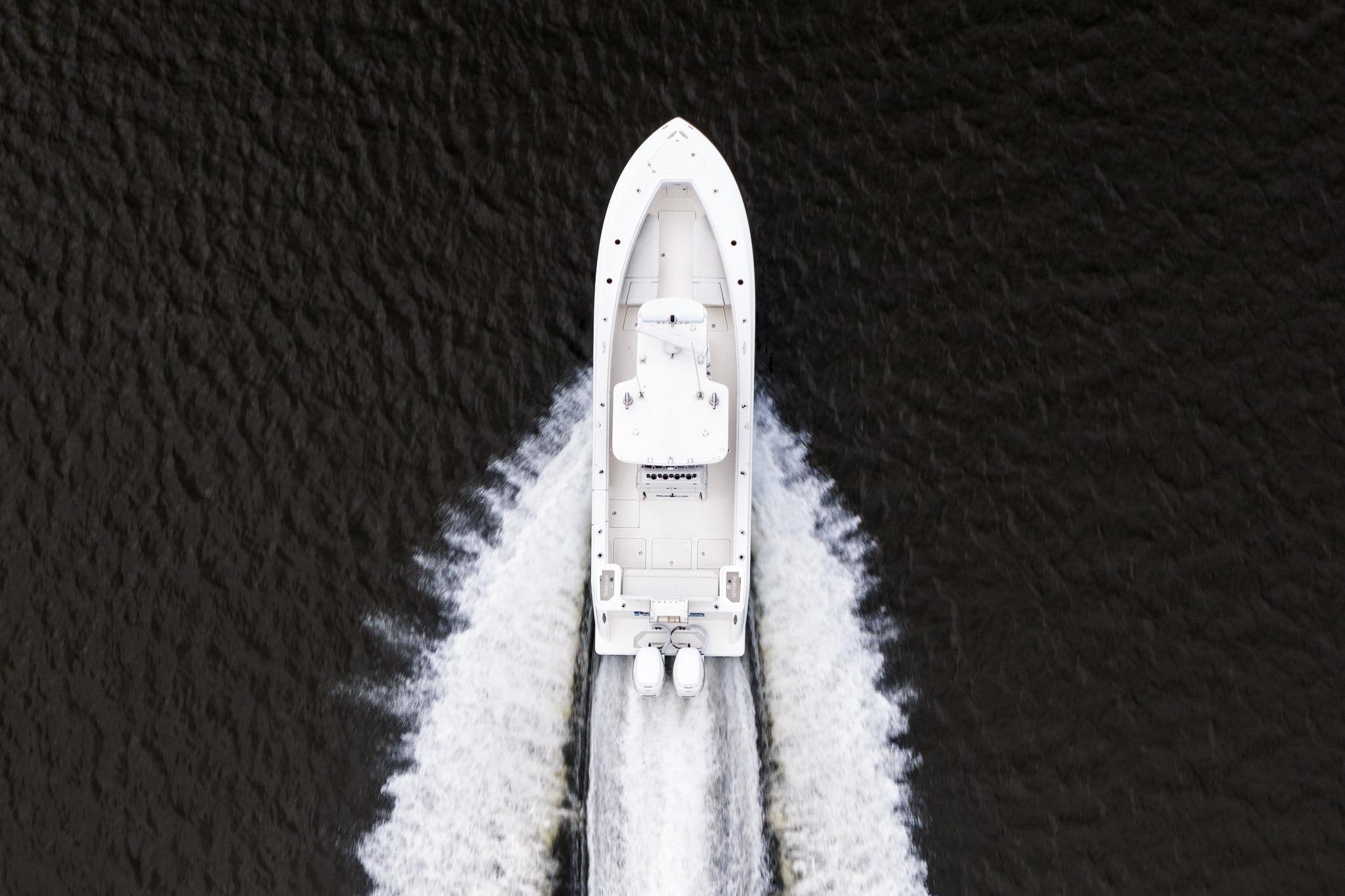 Overhead view of 2019 SeaVee 322Z boat cruising on water, creating a wake.