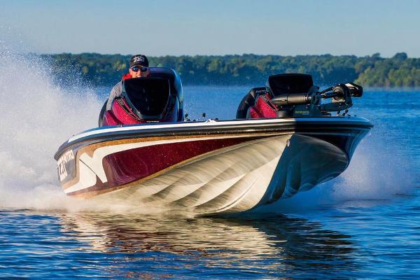 Manufacturer Provided Image: 2018 Nitro Z20 Pro boat speeding on a lake with a scenic forest backdrop.