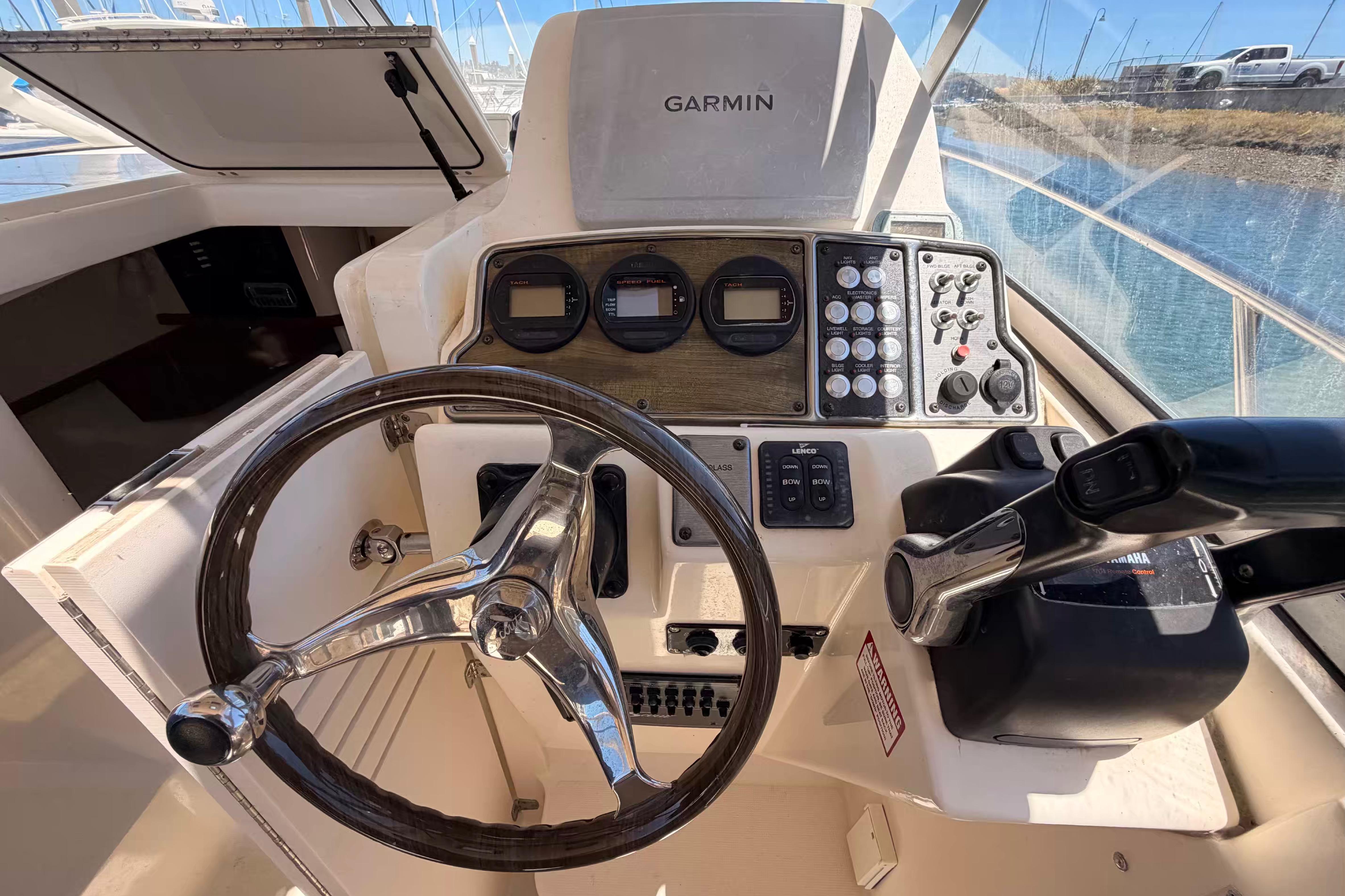 Helm of 2007 Scout 262 Abaco boat with Garmin navigation system and controls.