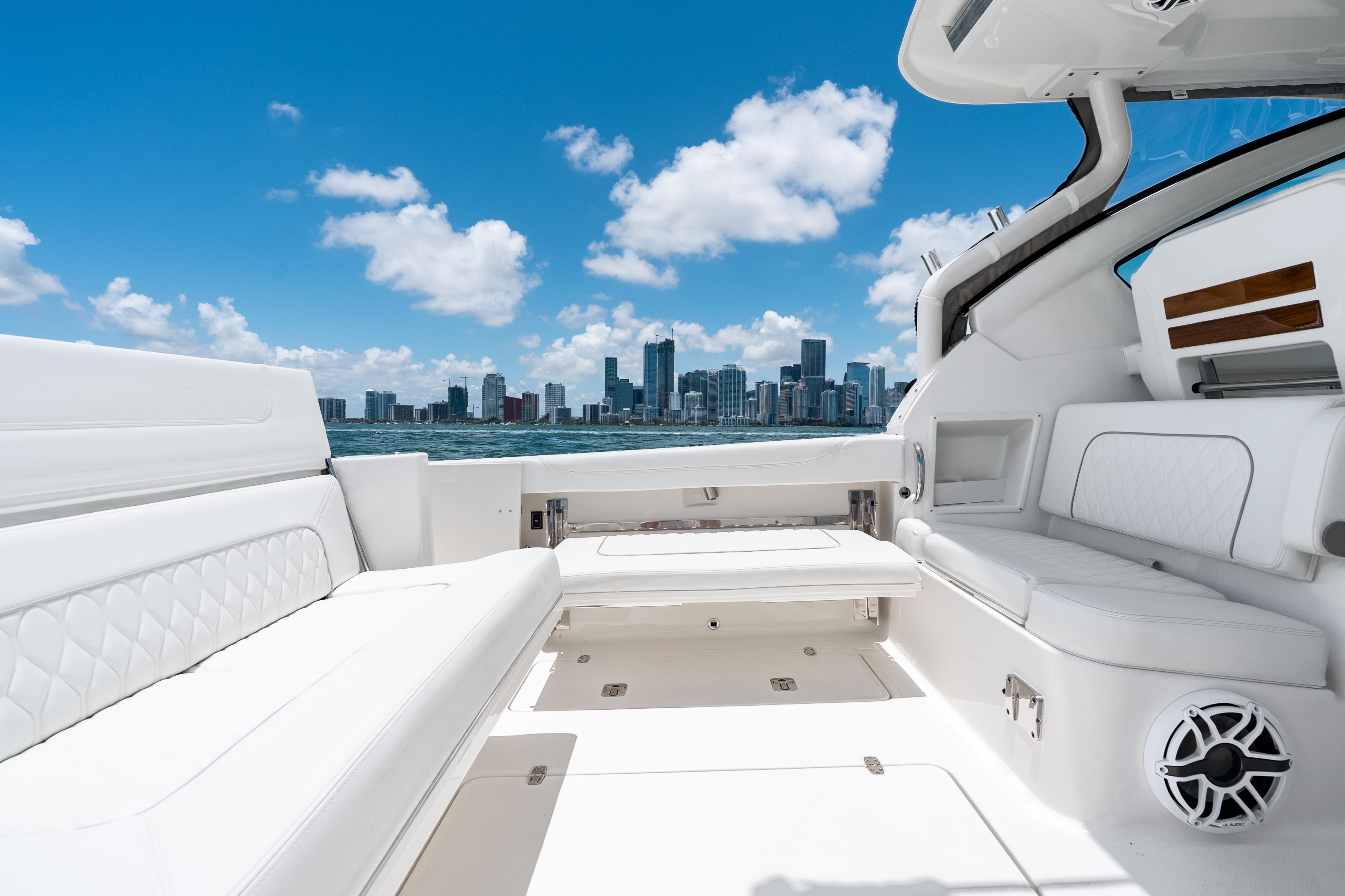 2026 Pursuit DC 326 Dual Console boat interior with city skyline view.