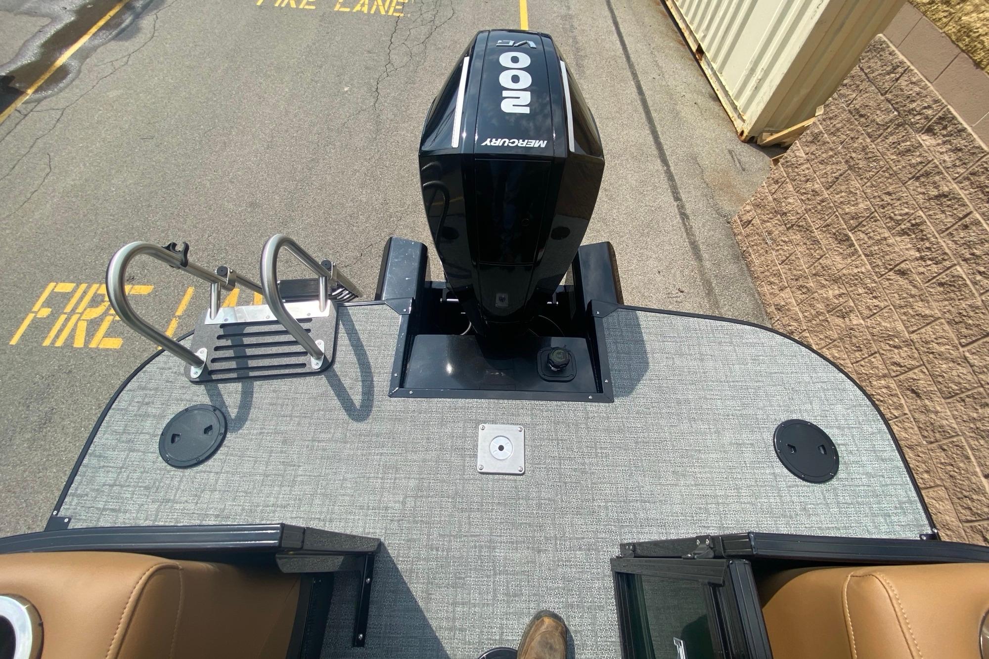 Top view of a 2026 Regency 230 DL boat deck with Mercury 200 engine.
