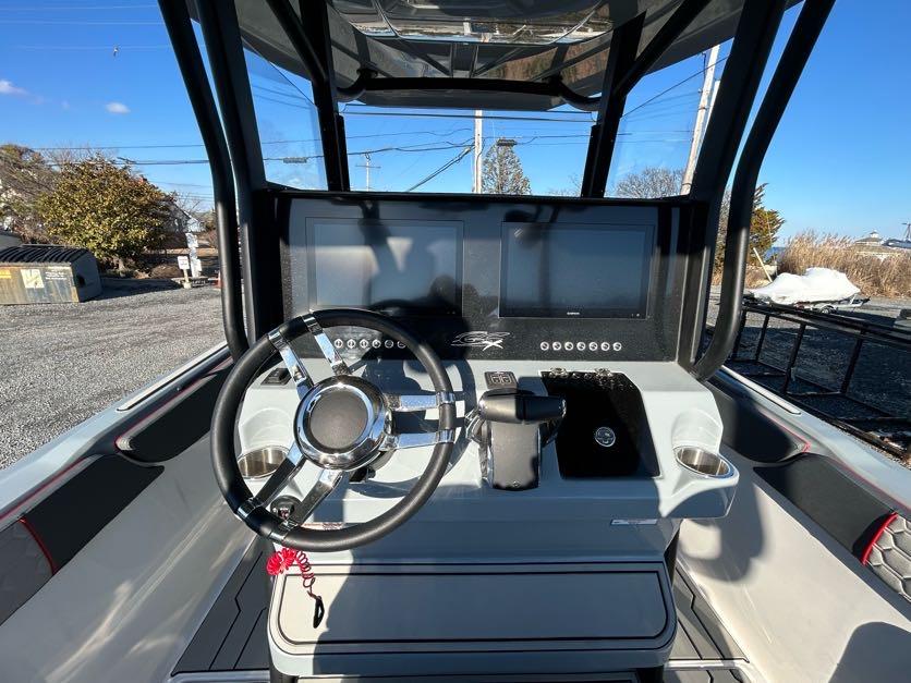 2024 Glasstream 32 GSX boat dashboard with steering wheel and dual screens.