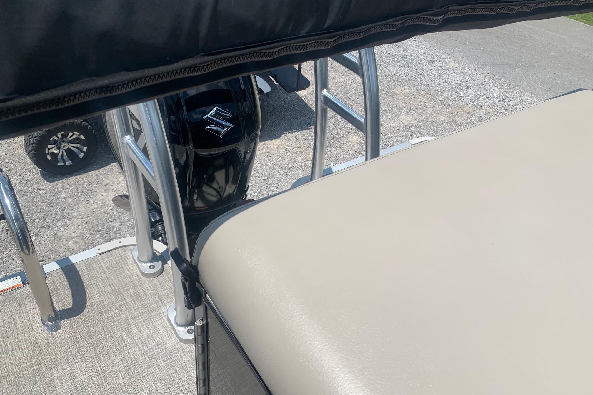 2023 Silver Wave 2410 SW3 CLS boat with Suzuki outboard motor and beige seating.