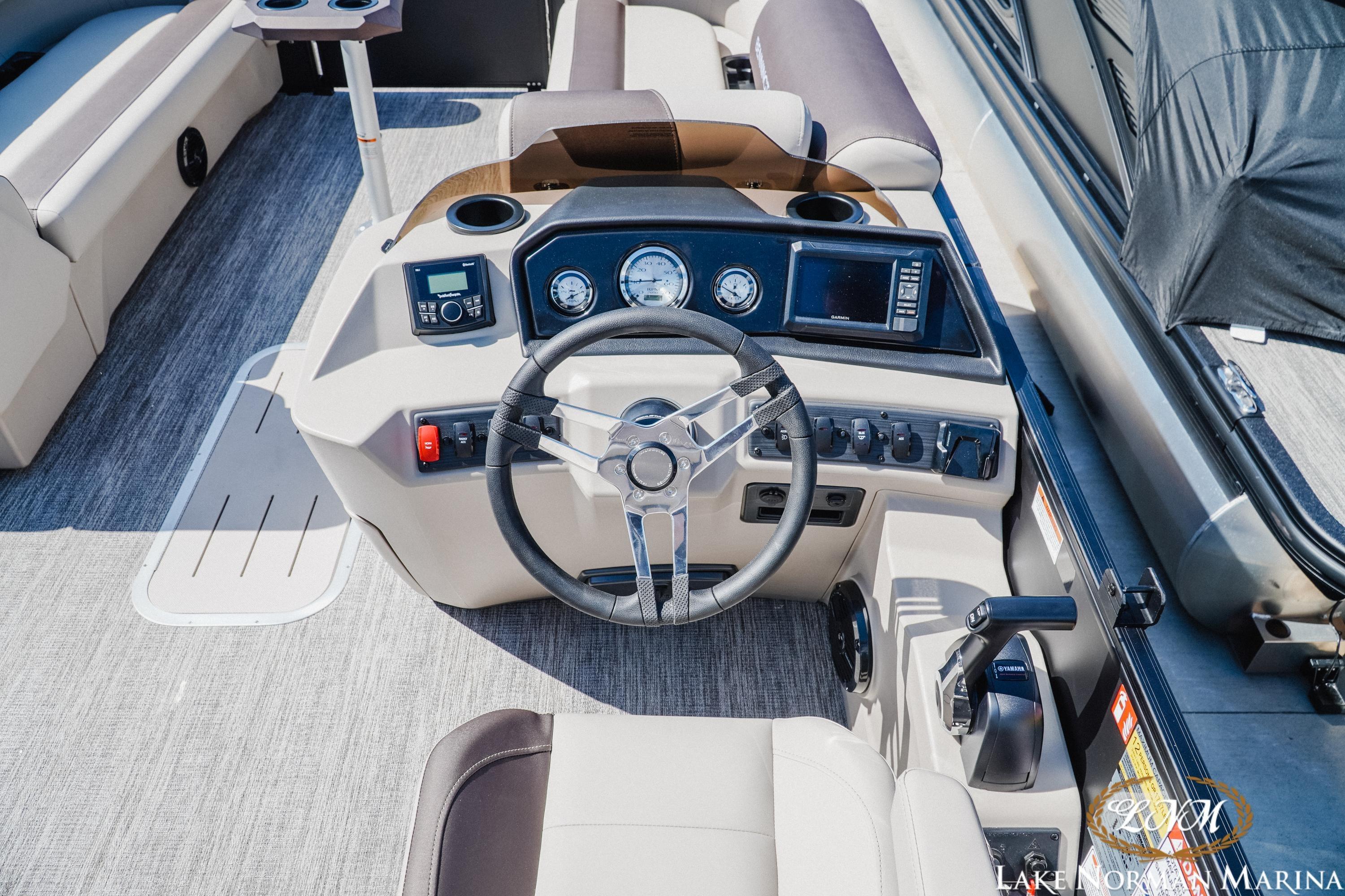 2027 Bennington 23ssb boat dashboard with steering wheel and control panel.