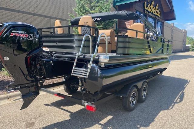 2026 Ranger 220F boat with Mercury Pro XS engine on trailer outside Cabela's store.
