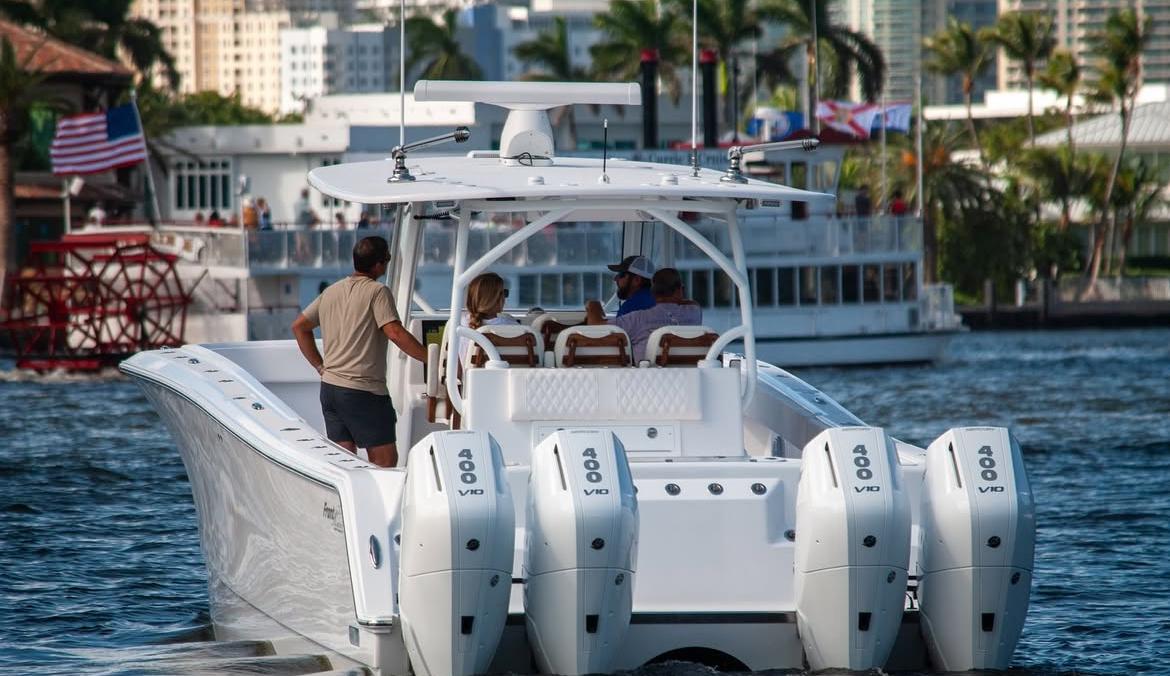 Front Runner 43 Catamaran 2026 cruising in a lively marina with passengers onboard.