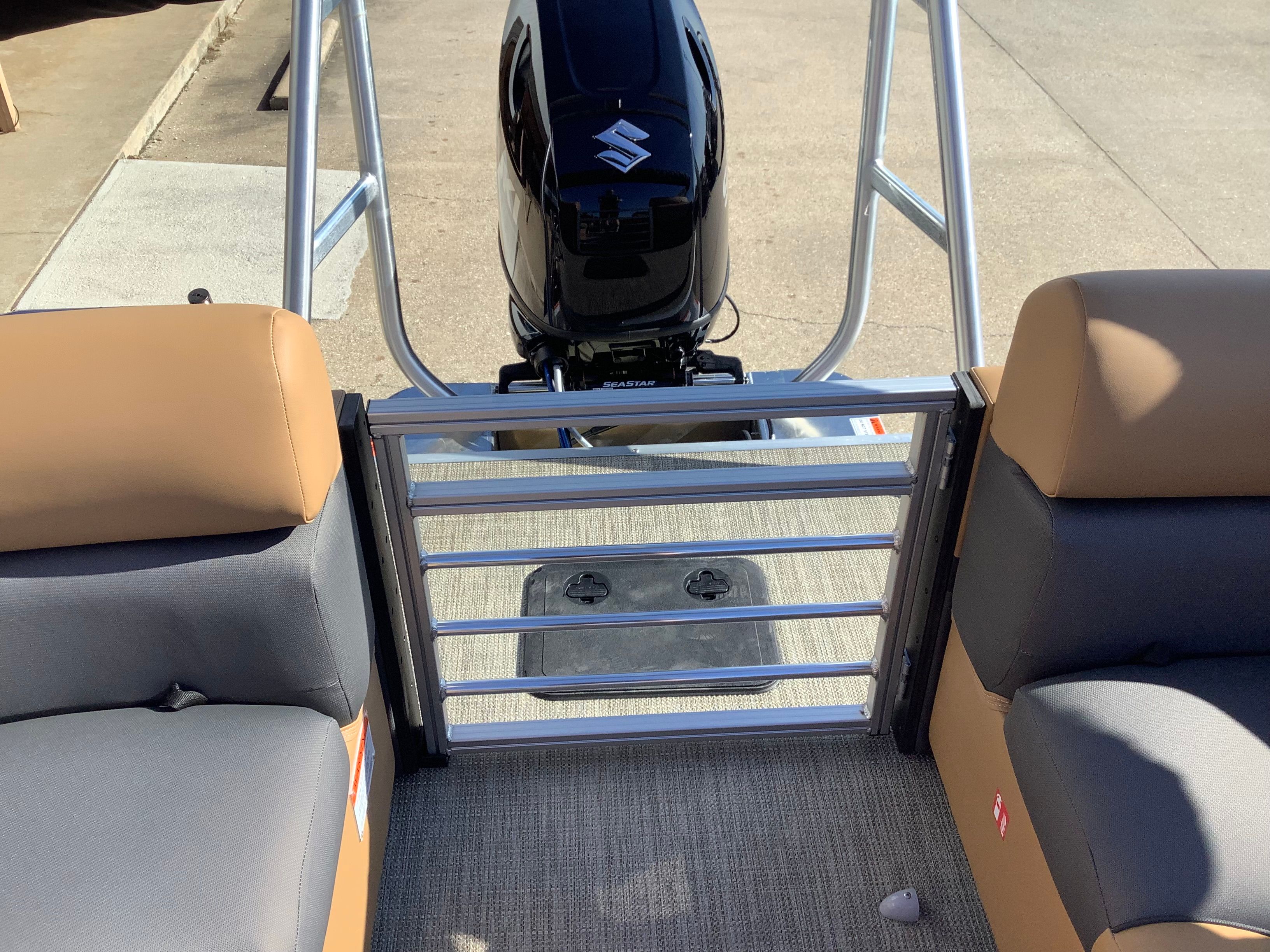 Interior of 2026 Landau 21 Island Breeze with Suzuki engine.