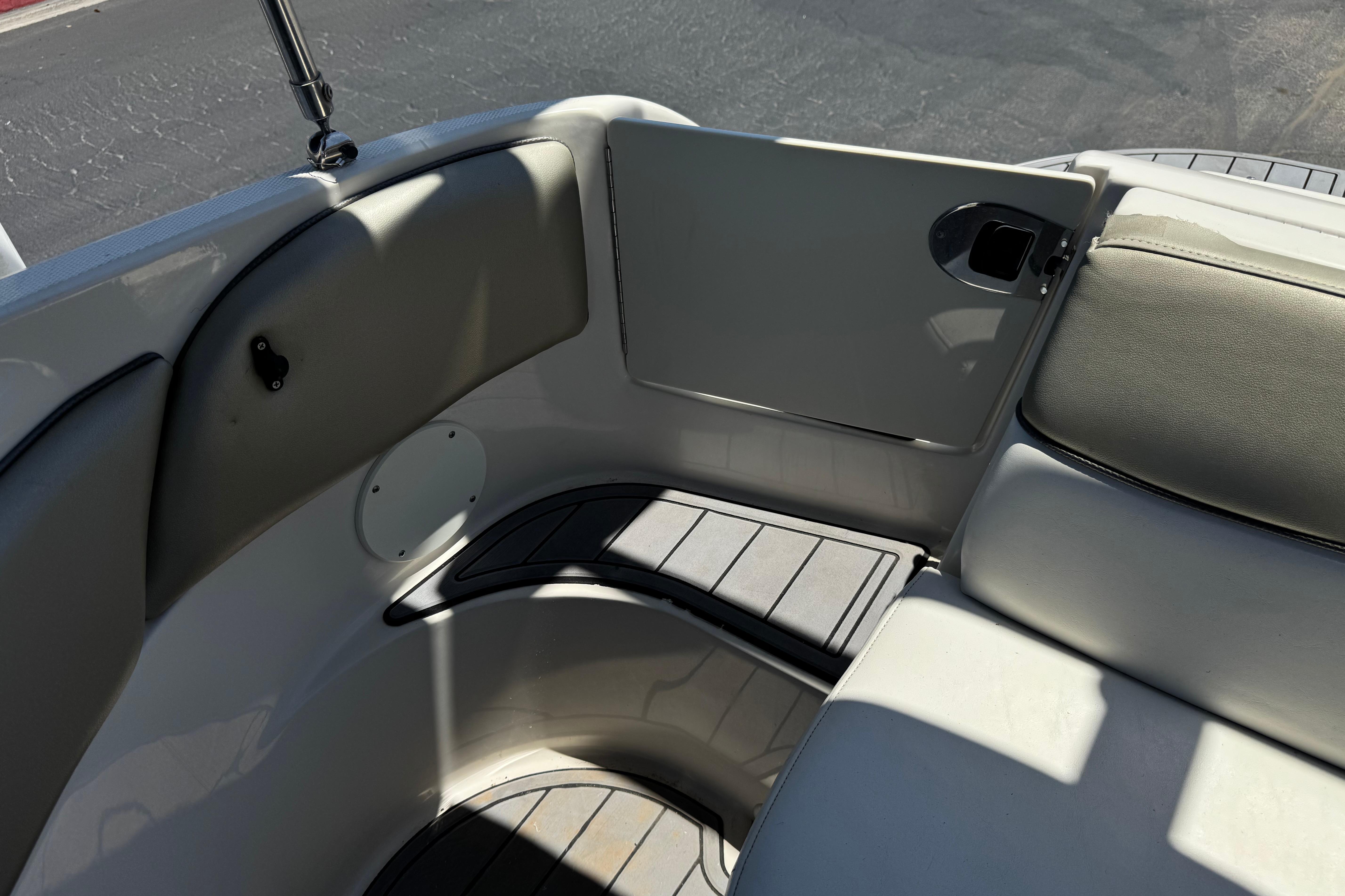 Interior seating area of a 2007 Sea Ray 240 Sundeck boat, featuring cushioned seats.