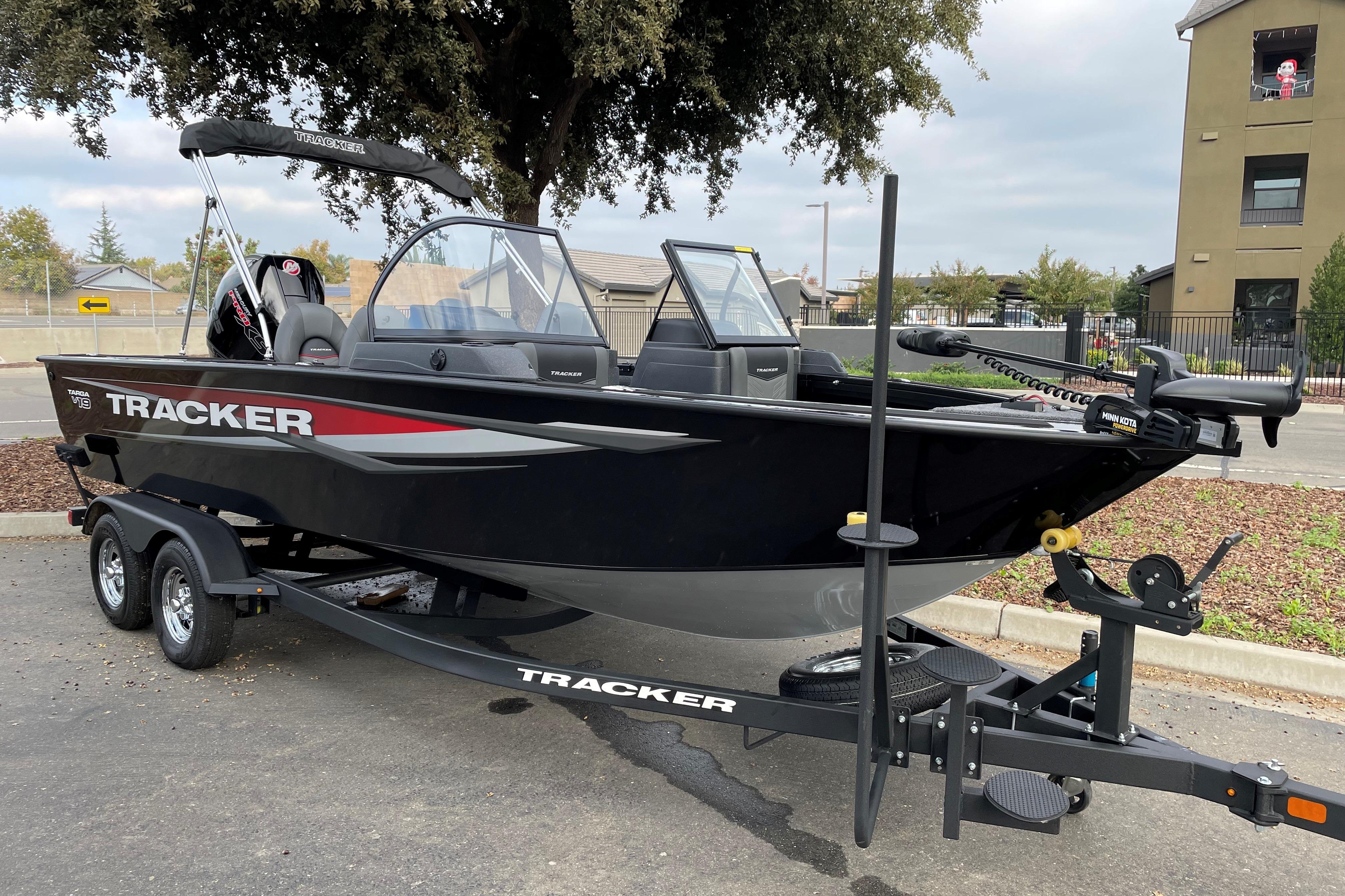 2026 Tracker Targa V-19 WT boat on trailer, parked outdoors.