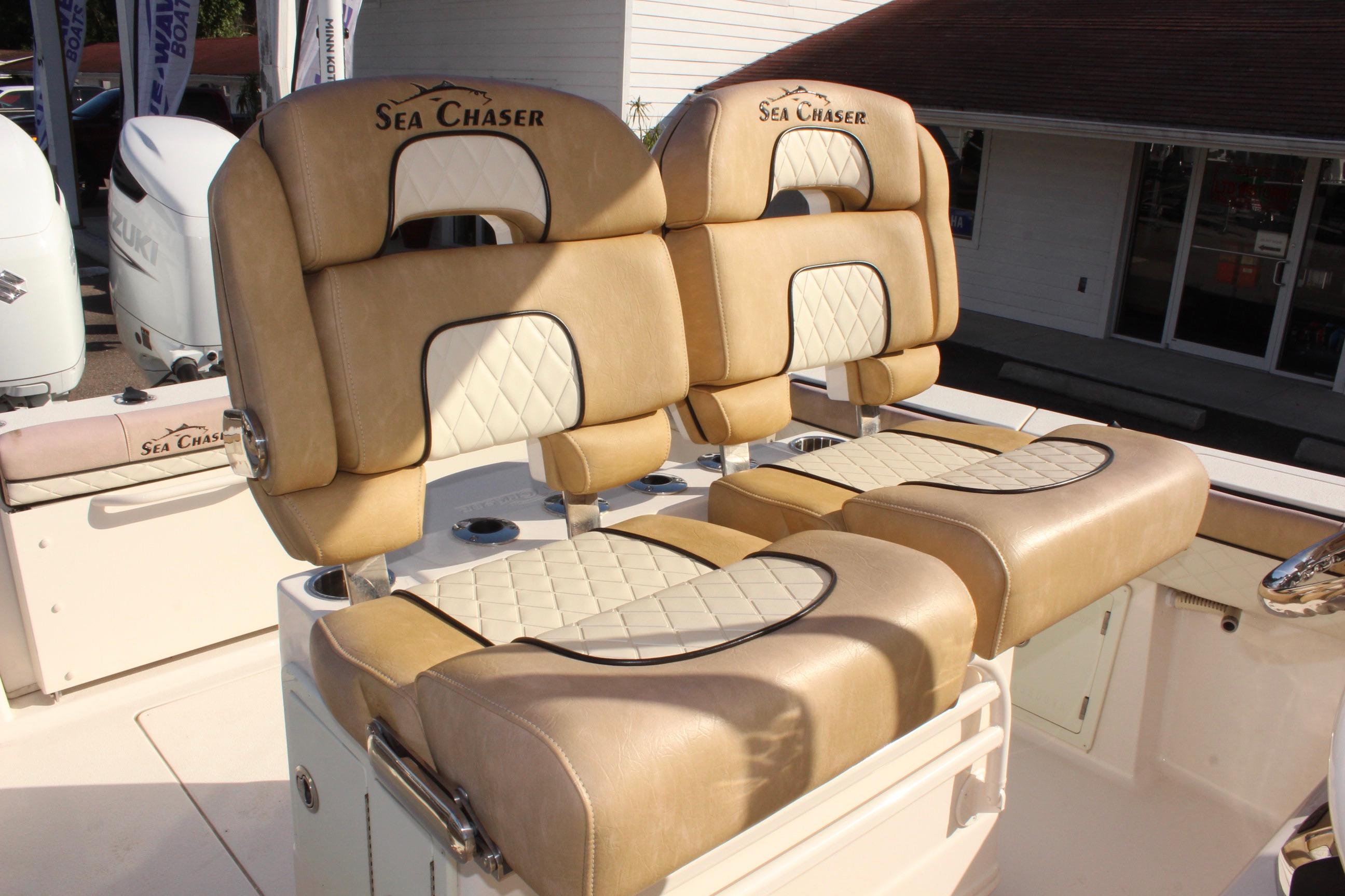 2023 Sea Chaser 27 HFC boat seats with tan and white upholstery.