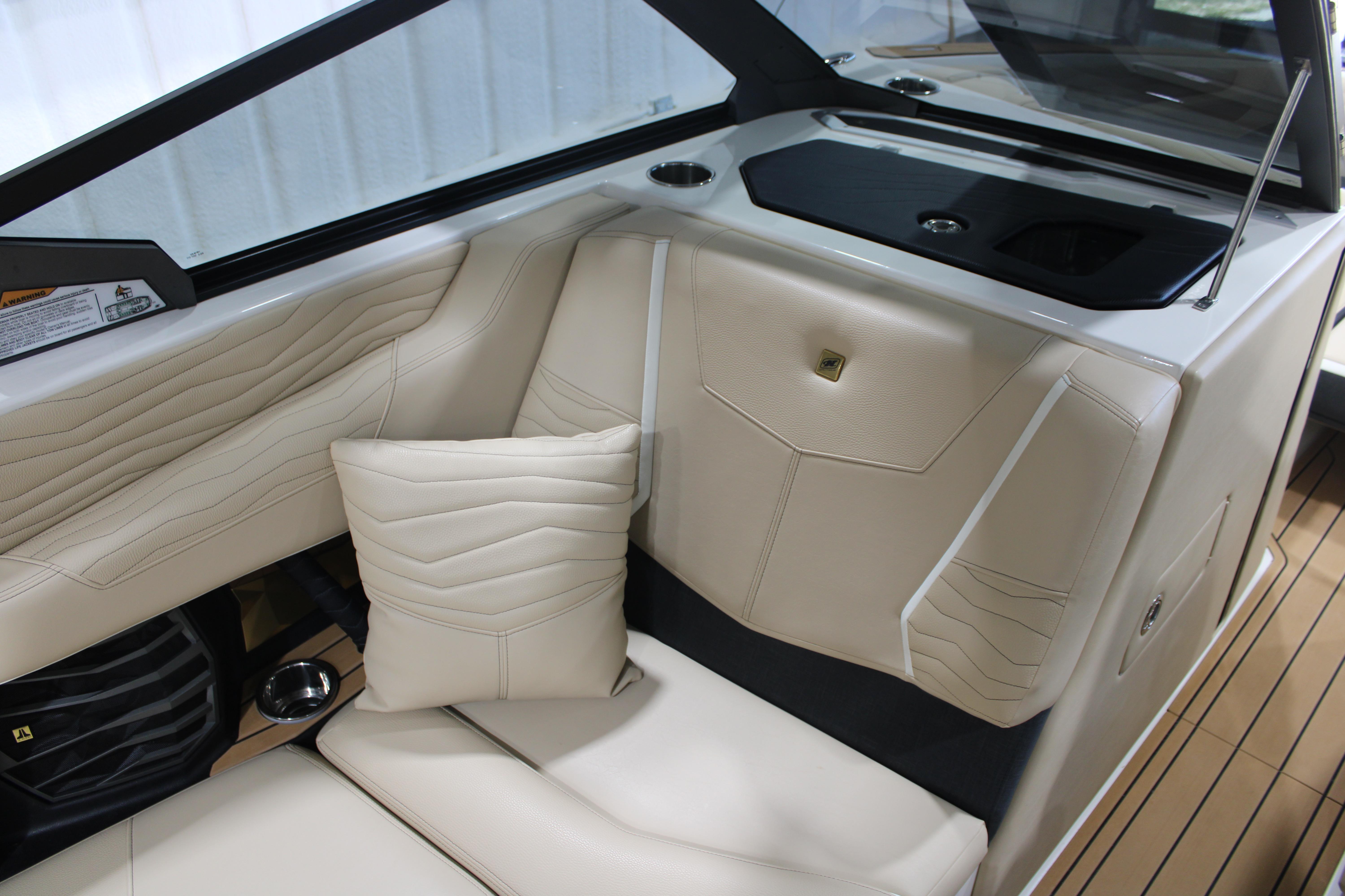Luxurious interior of 2025 Nautique Super Air Nautique G25 boat with beige seating.