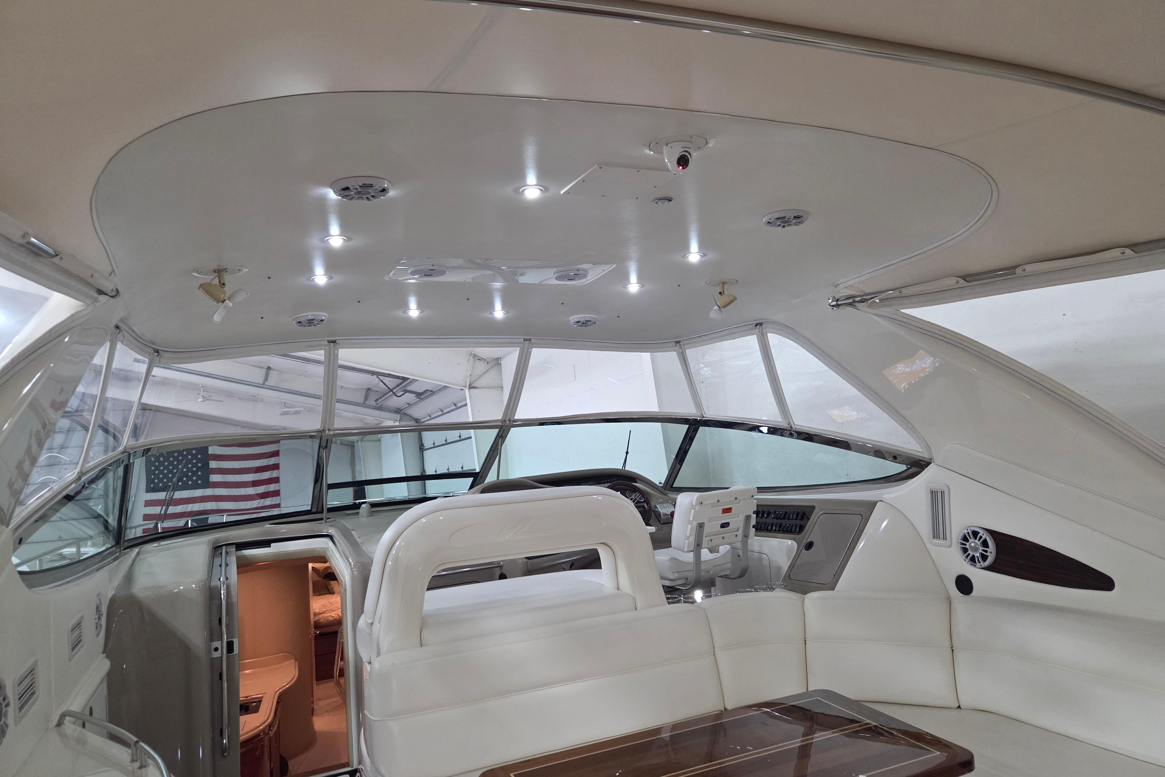 Interior view of a 2000 Sea Ray Sundancer 540 yacht with elegant seating and helm.