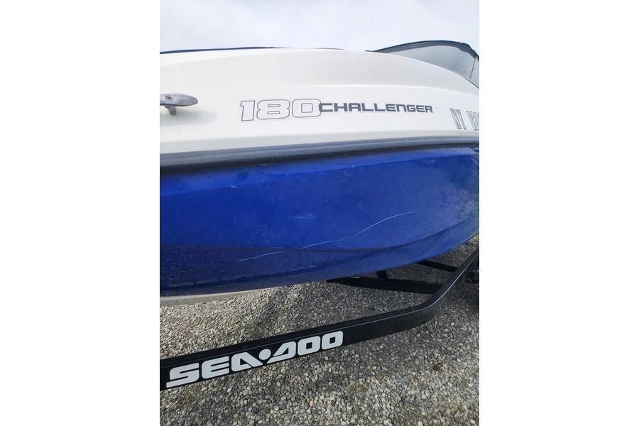 2012 Sea-Doo Sport Boats 180 Challenger, blue and white hull, on a trailer.