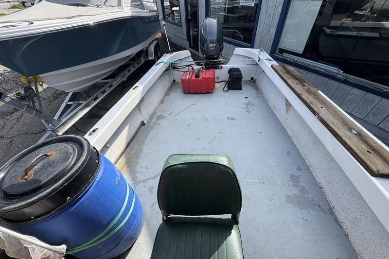 2001 ROS Boats 19 RUNABOUT interior with motor, fuel tank, and seating.