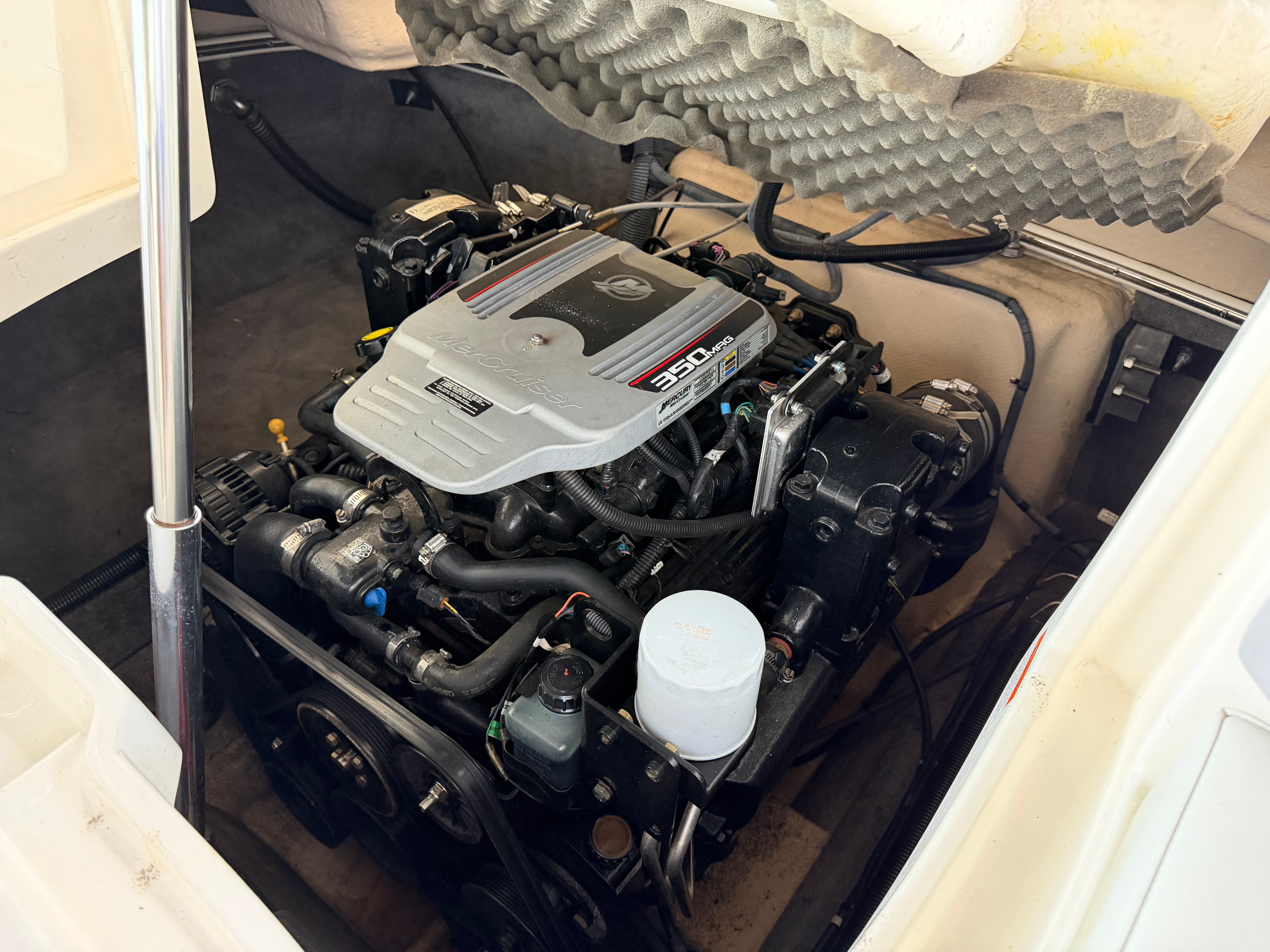 Engine compartment of a 2010 Bryant 255 boat with 350 MAG engine.