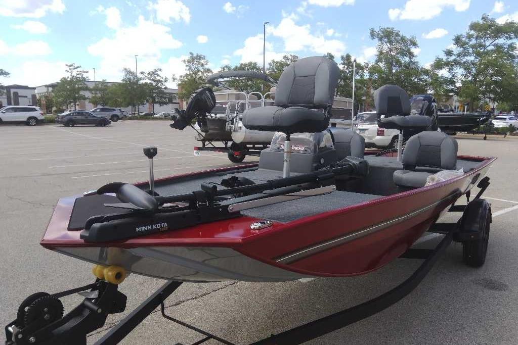 2026 Tracker Bass Tracker Classic XL boat in parking lot, featuring Minn Kota trolling motor.