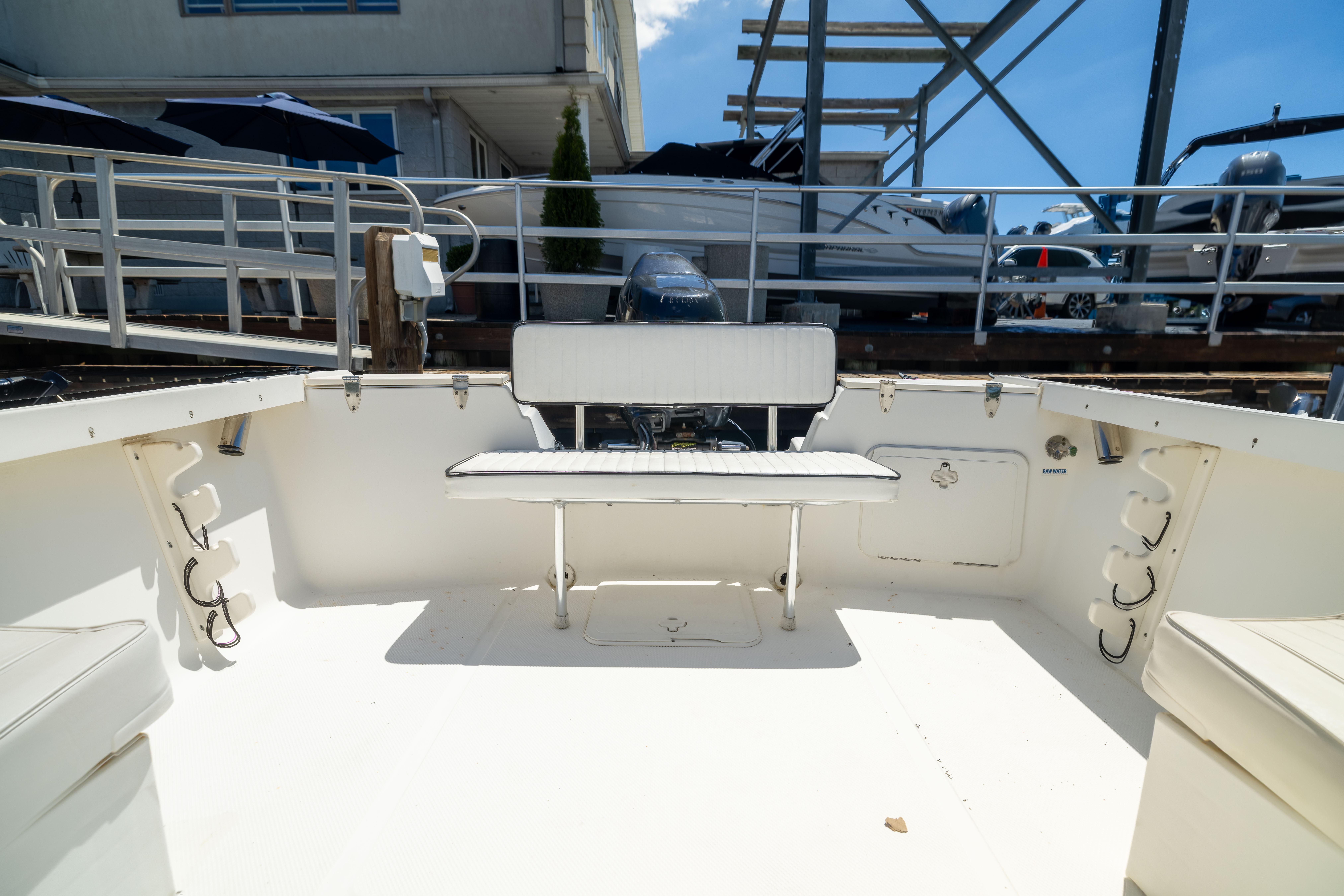 Interior view of a 2012 KEYWEST 2020 WA boat, featuring seating and storage compartments.
