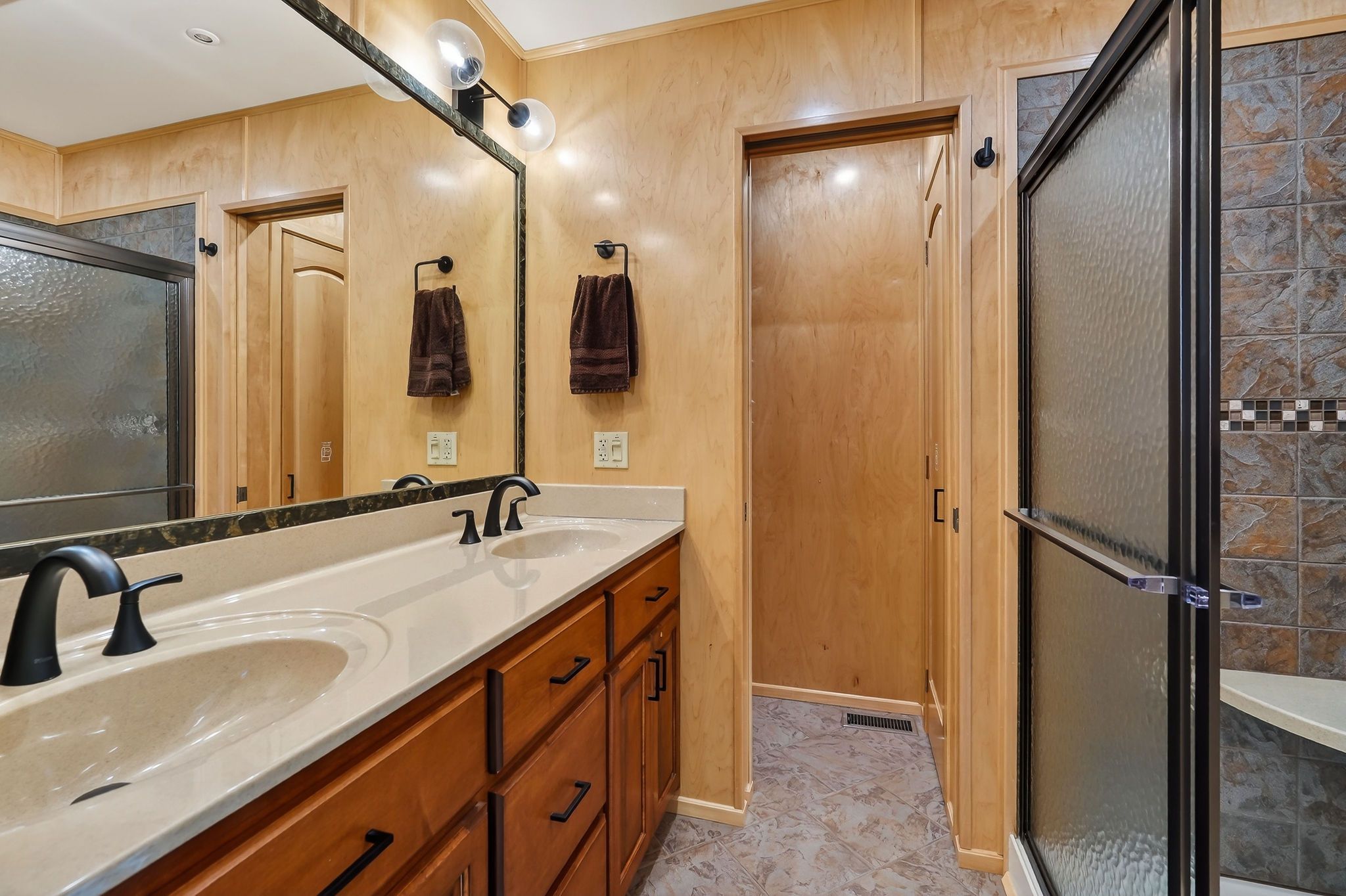 Modern bathroom in a 2010 Houseboat with double sinks.
