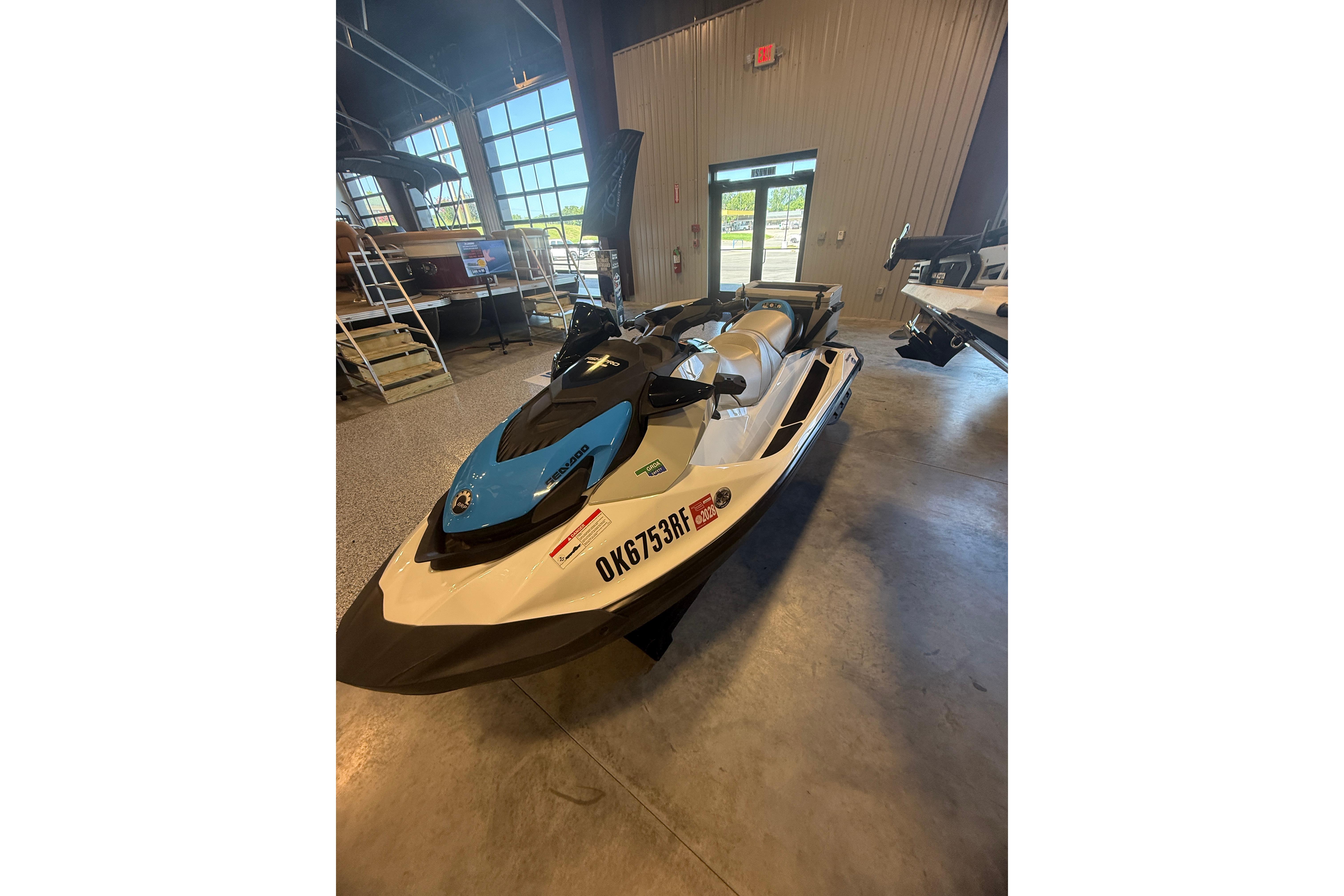 2022 Seadoo FishPro jet ski in showroom, featuring sleek design and blue accents.