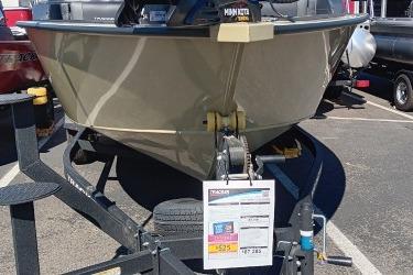 2026 Tracker Targa V-19 Combo boat on trailer in parking lot.