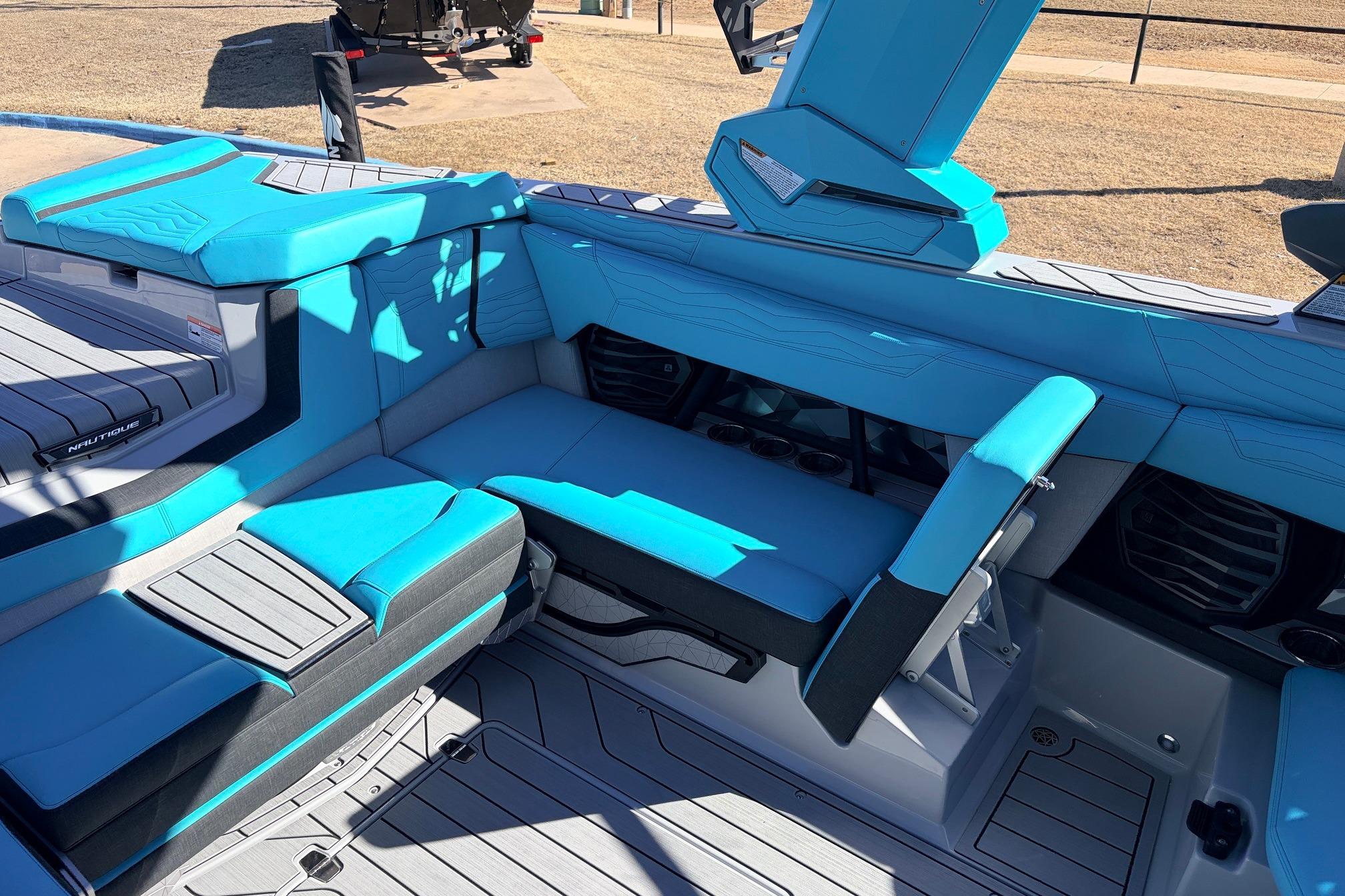 Interior of 2026 Nautique Super Air Nautique G23 with blue seating and modern design.