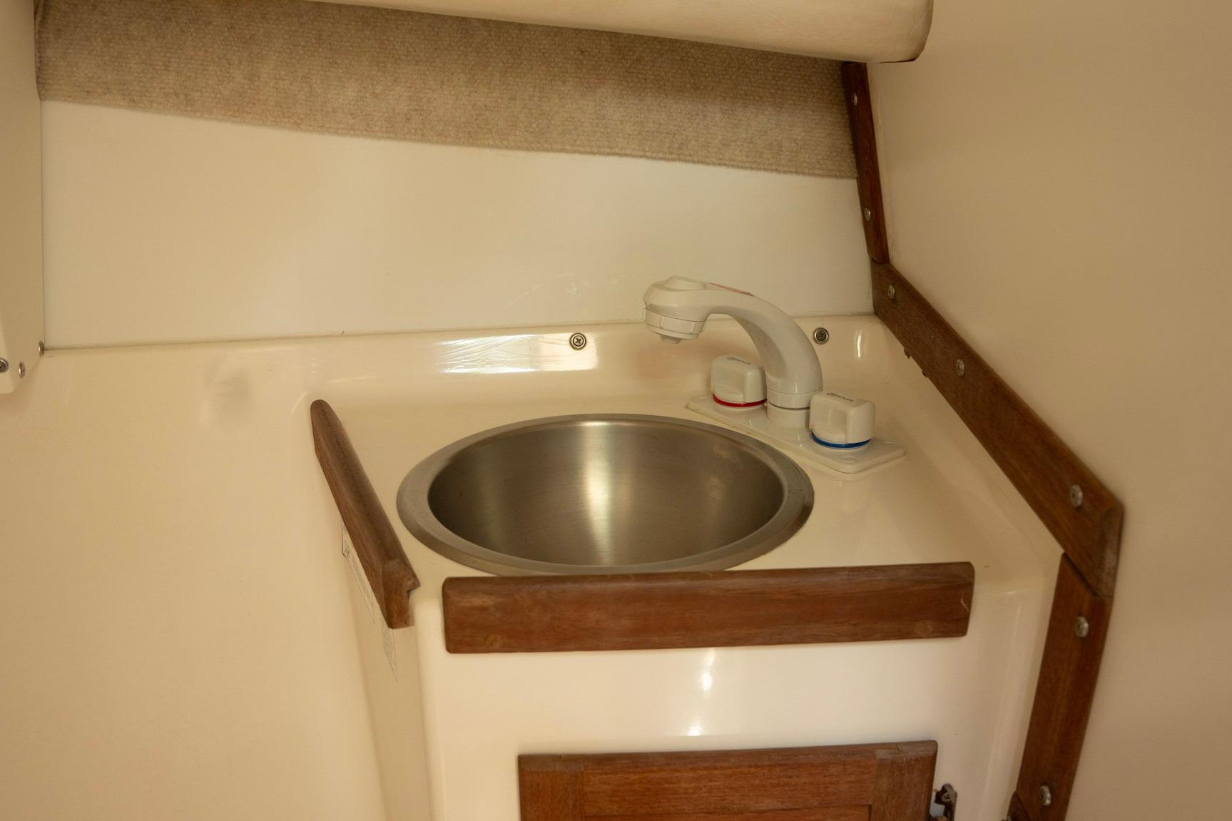 Compact sink area in 2006 Atlas Boat Works Acadia 25 cabin.