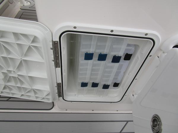 Open storage compartment on 2025 Solara S-250 CW boat.