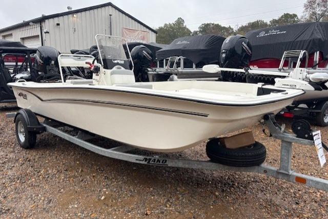 2026 Mako Pro Skiff 17 CC boat on trailer in outdoor showroom.