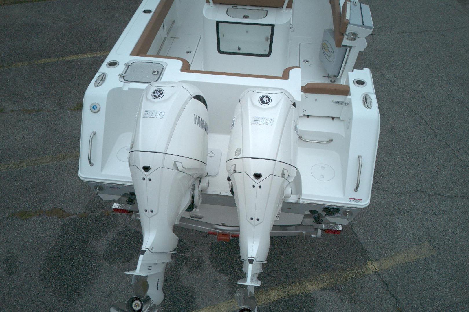 2026 Sea Hunt Gamefish 25 boat with dual Yamaha 200 engines, viewed from above.