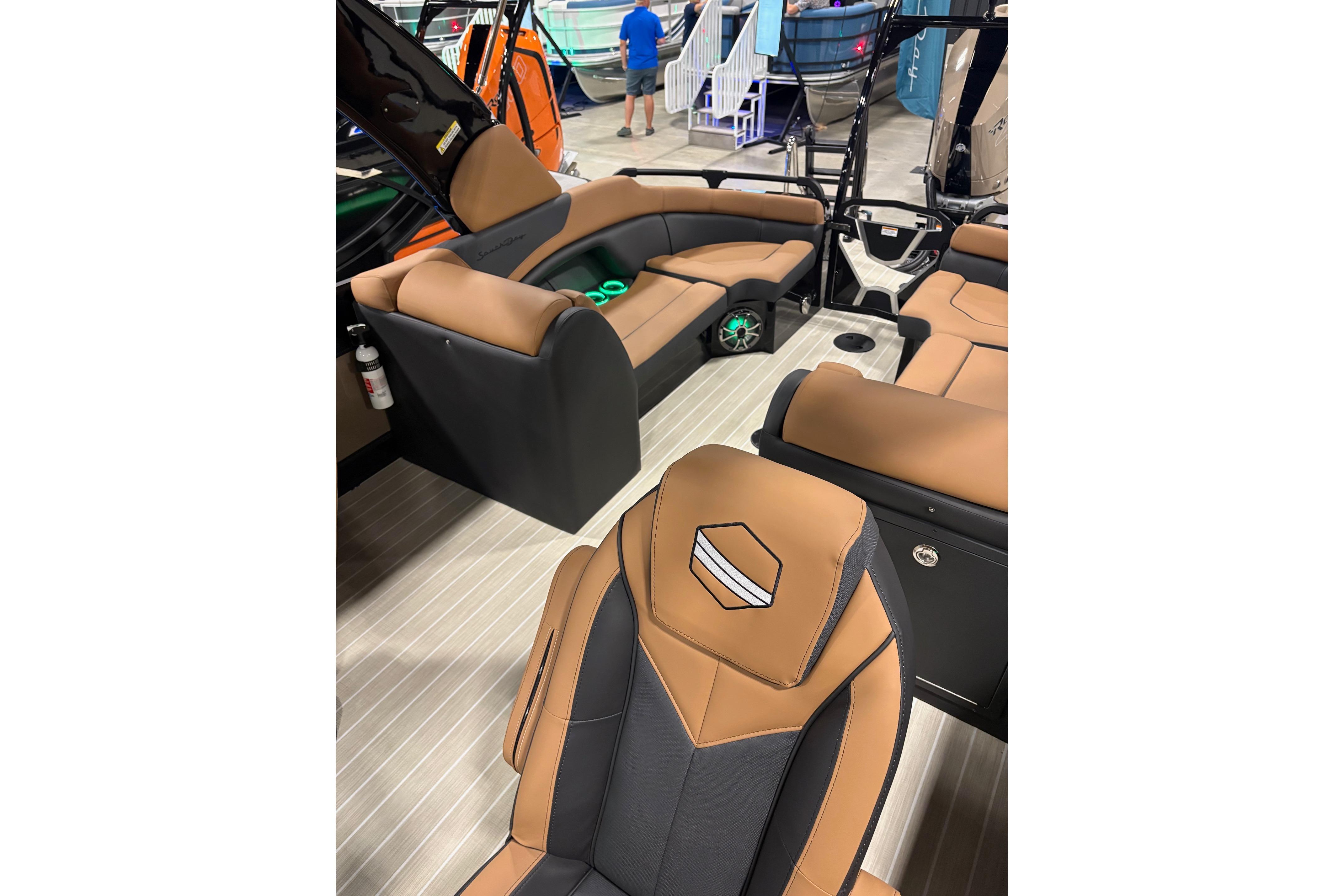 2026 South Bay Sport RS9 DC boat interior with tan and black seating.