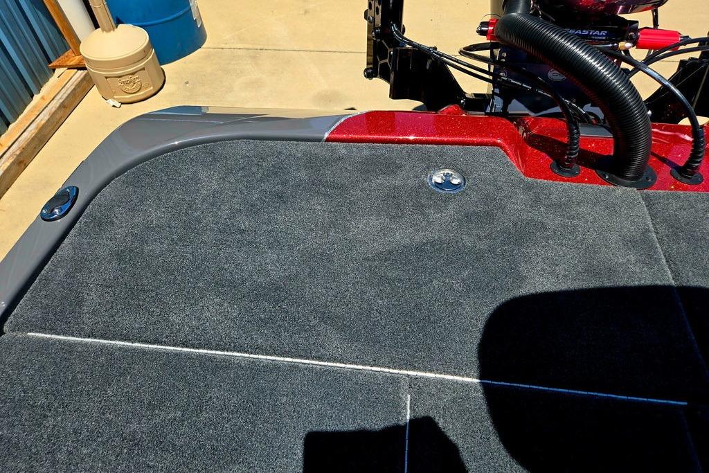2026 Skeeter ZXE20 boat deck with gray carpet and red accents.