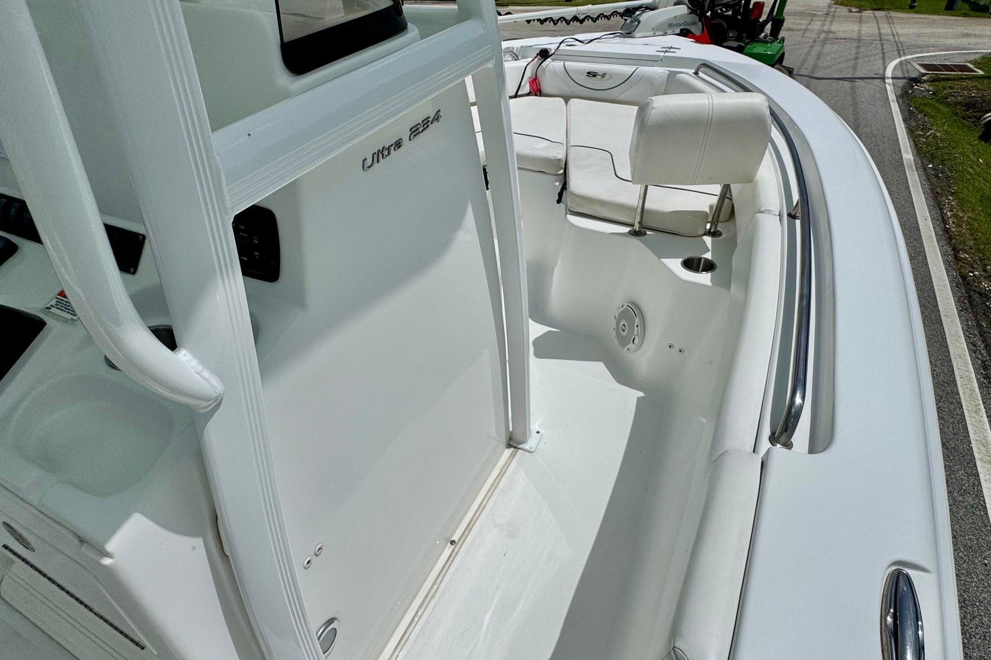 2015 Sea Hunt Ultra 234 boat interior with seating and console view.