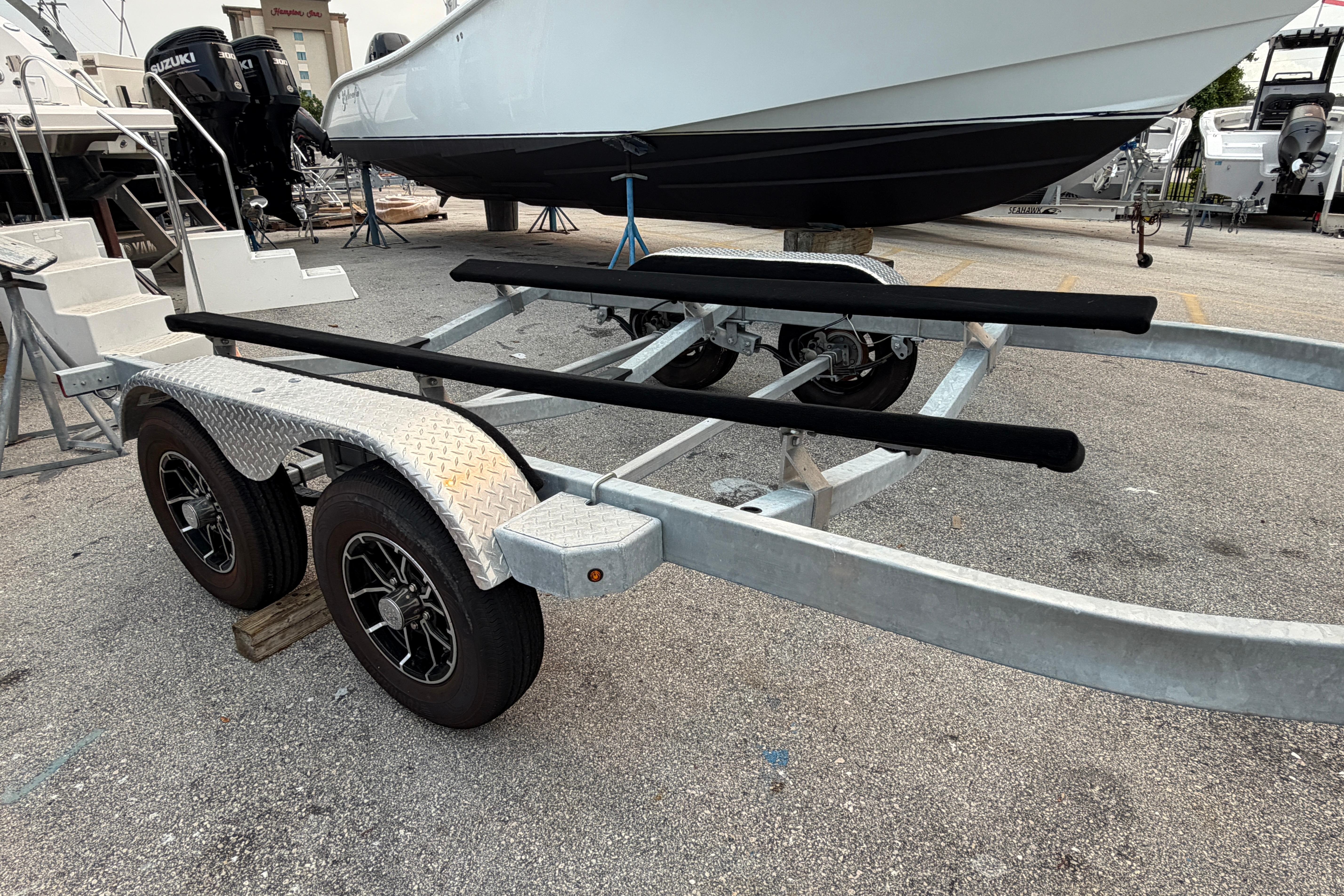 Boat trailer with dual axles and diamond plate fenders, model SRT5000, year 2024.