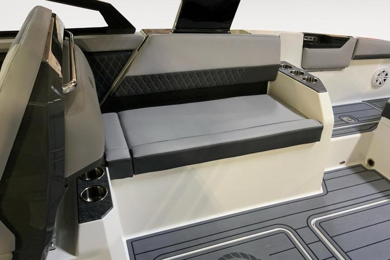 2026 Cobalt R31 boat interior with gray seating, cup holders, and modern design elements.