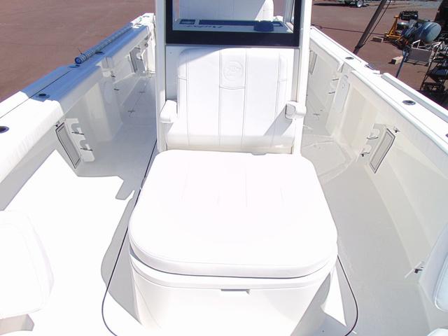2025 Parker 2600 CC boat interior with white seating and console.