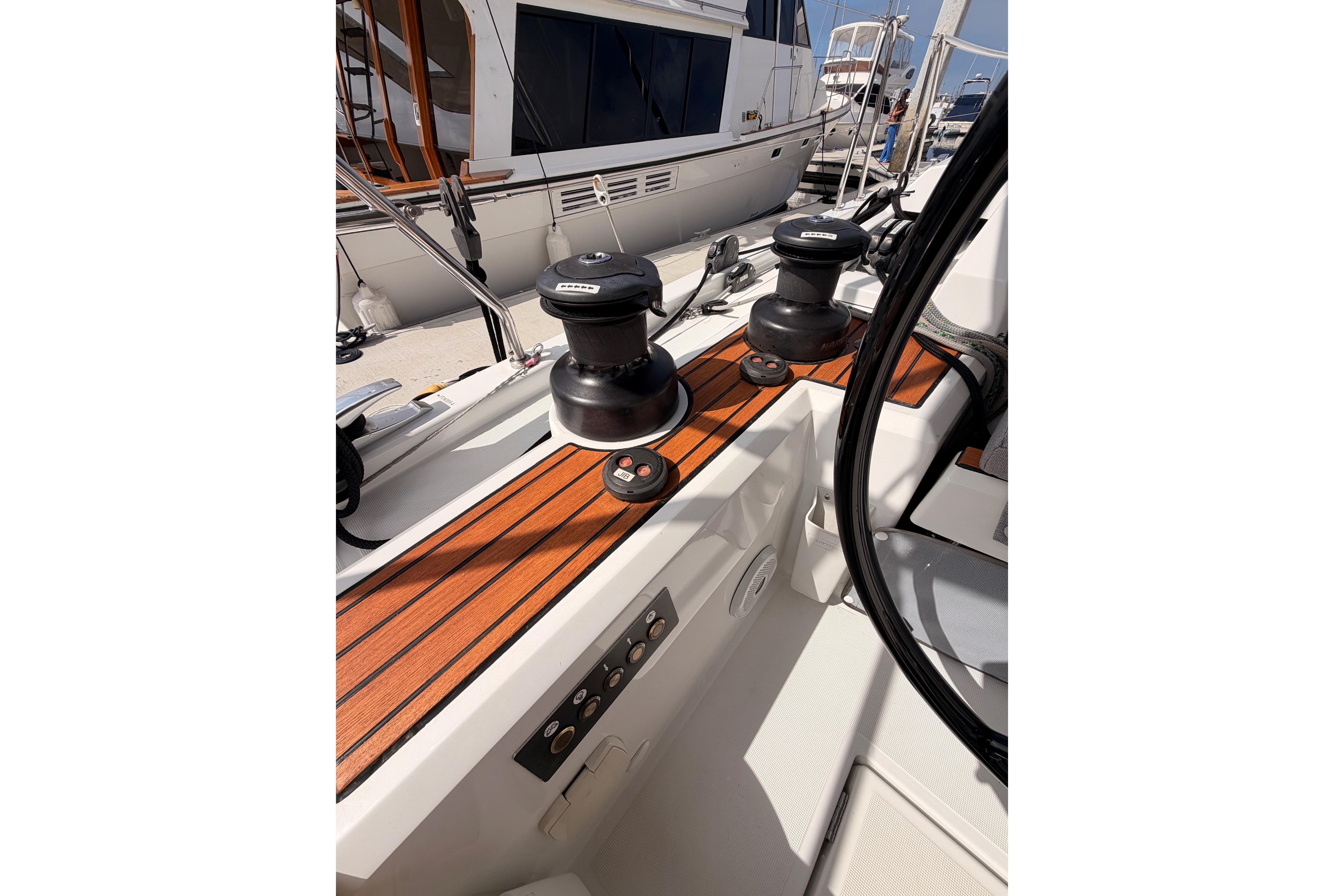 Cockpit view of 2020 Beneteau Oceanis 46.1 sailboat with winches and teak decking.