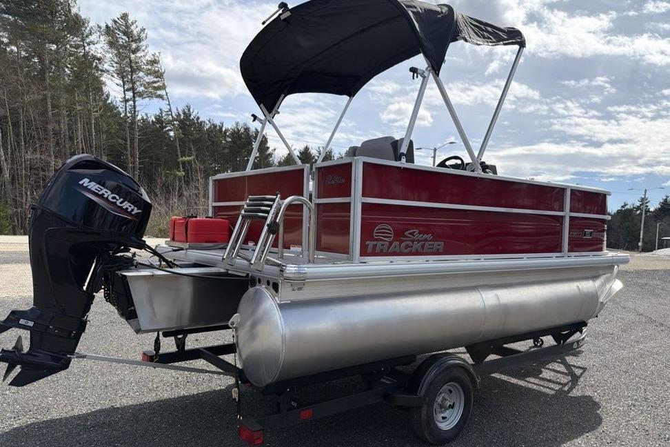 2026 Sun Tracker Party Barge 16 DLX pontoon boat with Mercury outboard motor.