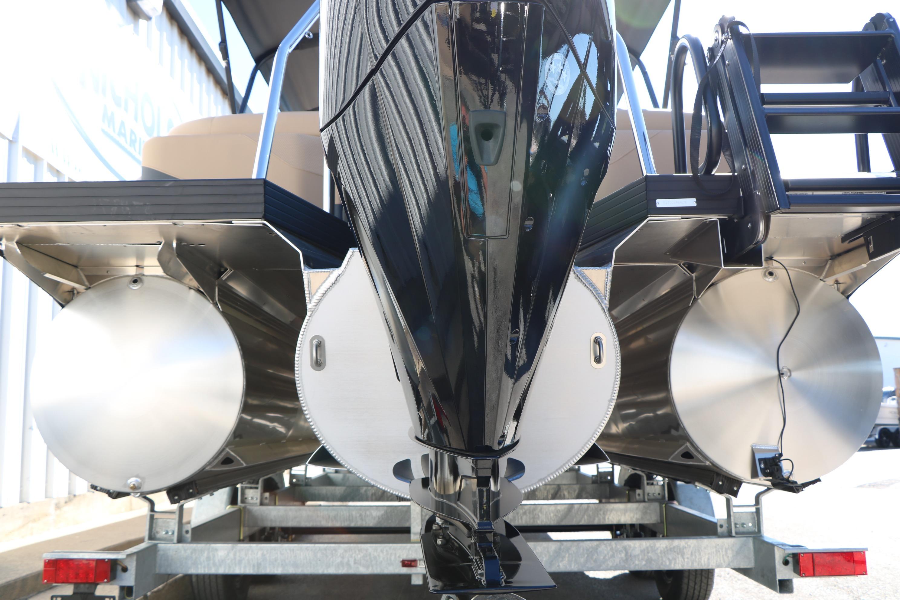 2026 Evotti 525 QL Tri-Toon boat on trailer, showcasing triple pontoon design.