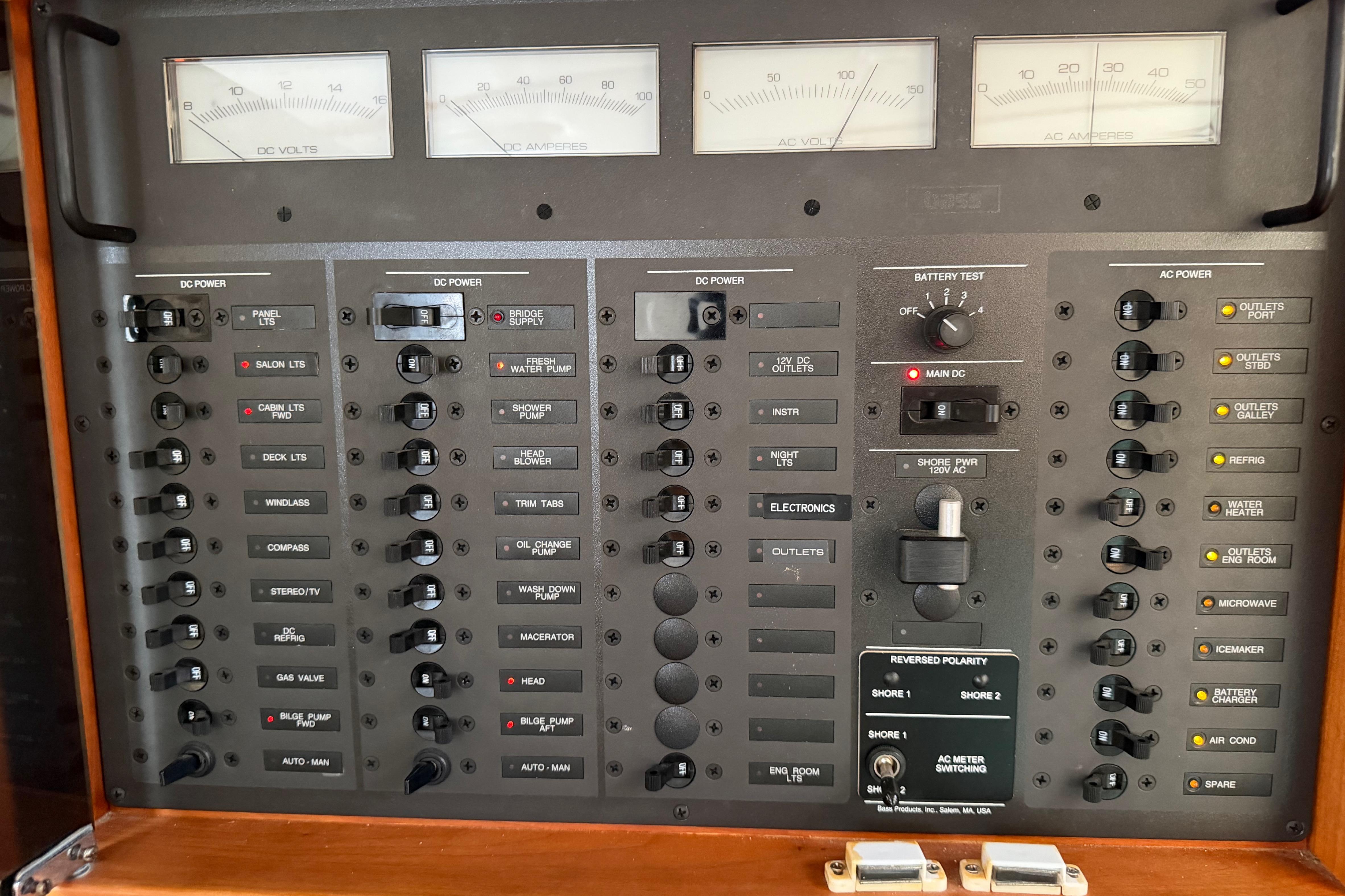 Electrical control panel of a 2000 Sabreline 36 Express boat, featuring various switches and meters.