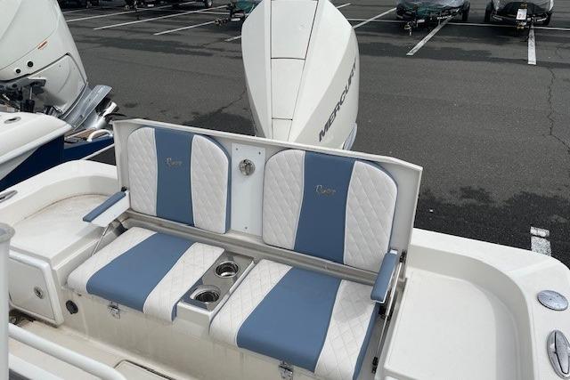 Ranger 2360 Bay 2025 boat rear seating with blue and white upholstery.
